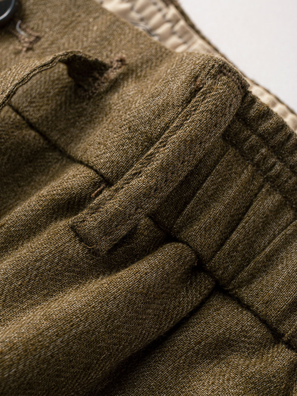 Belt loop detail on OROMEN Herringbone Weave Linen Trousers
