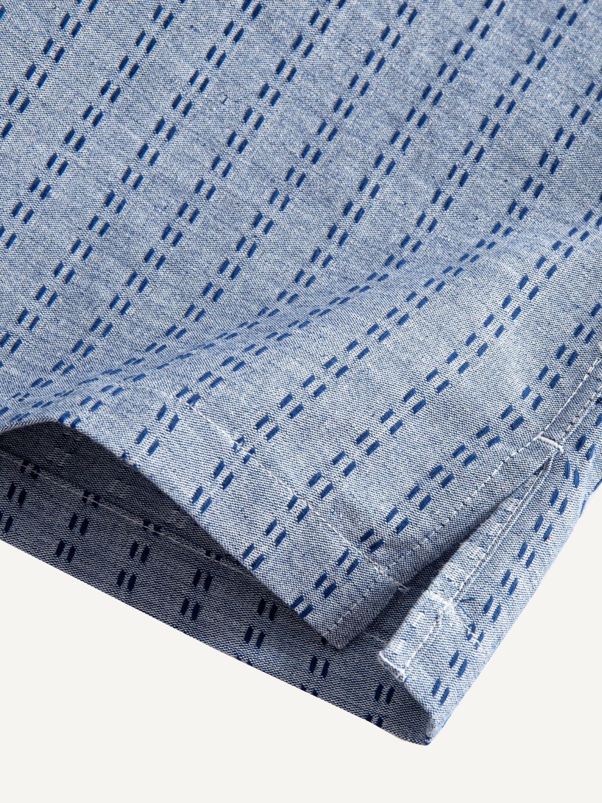 Clean hemline and side vent detail of OROMEN Sashiko Chambray Cotton Shirt