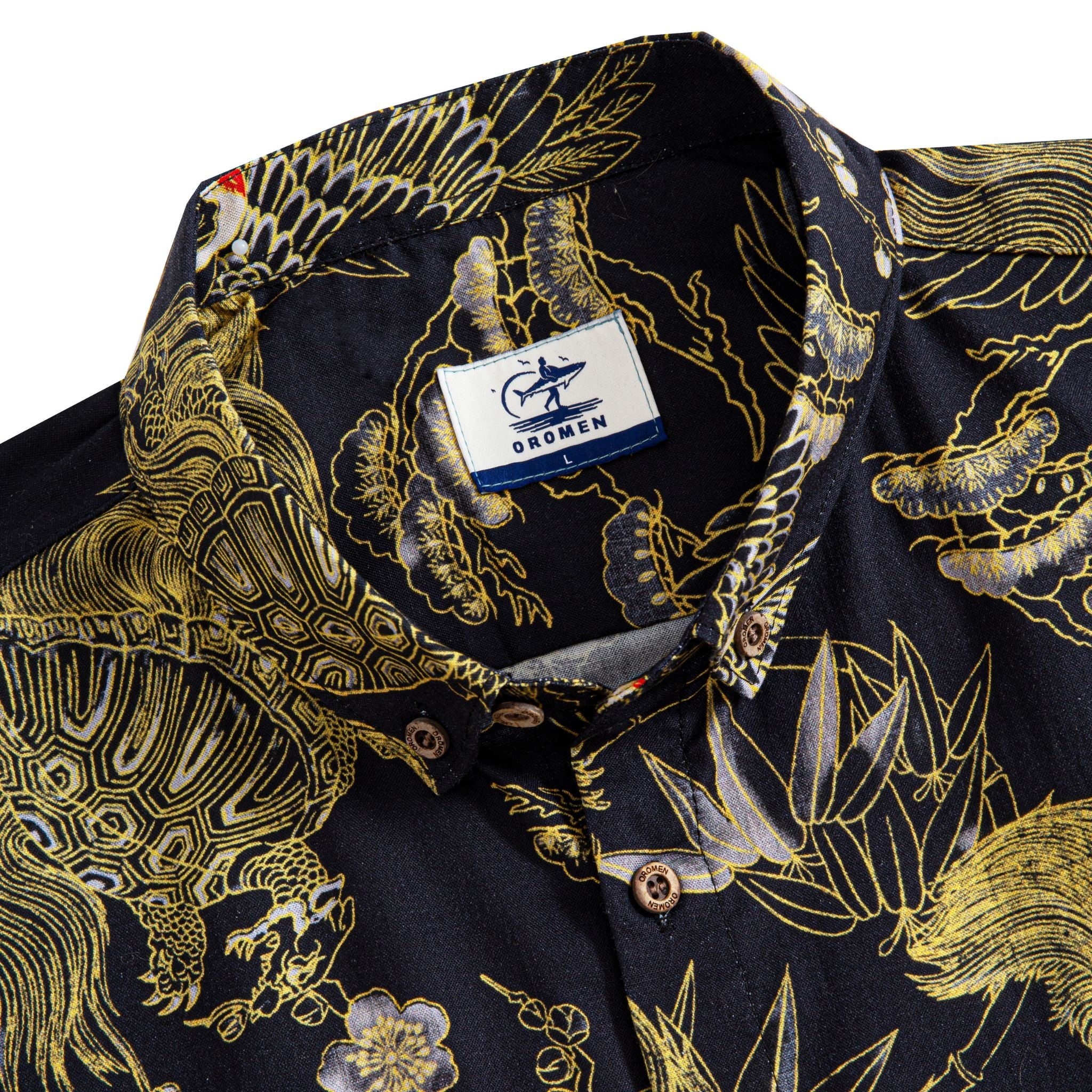 Close-up of hand-painted crane design with luxurious gold edges on cotton shirt