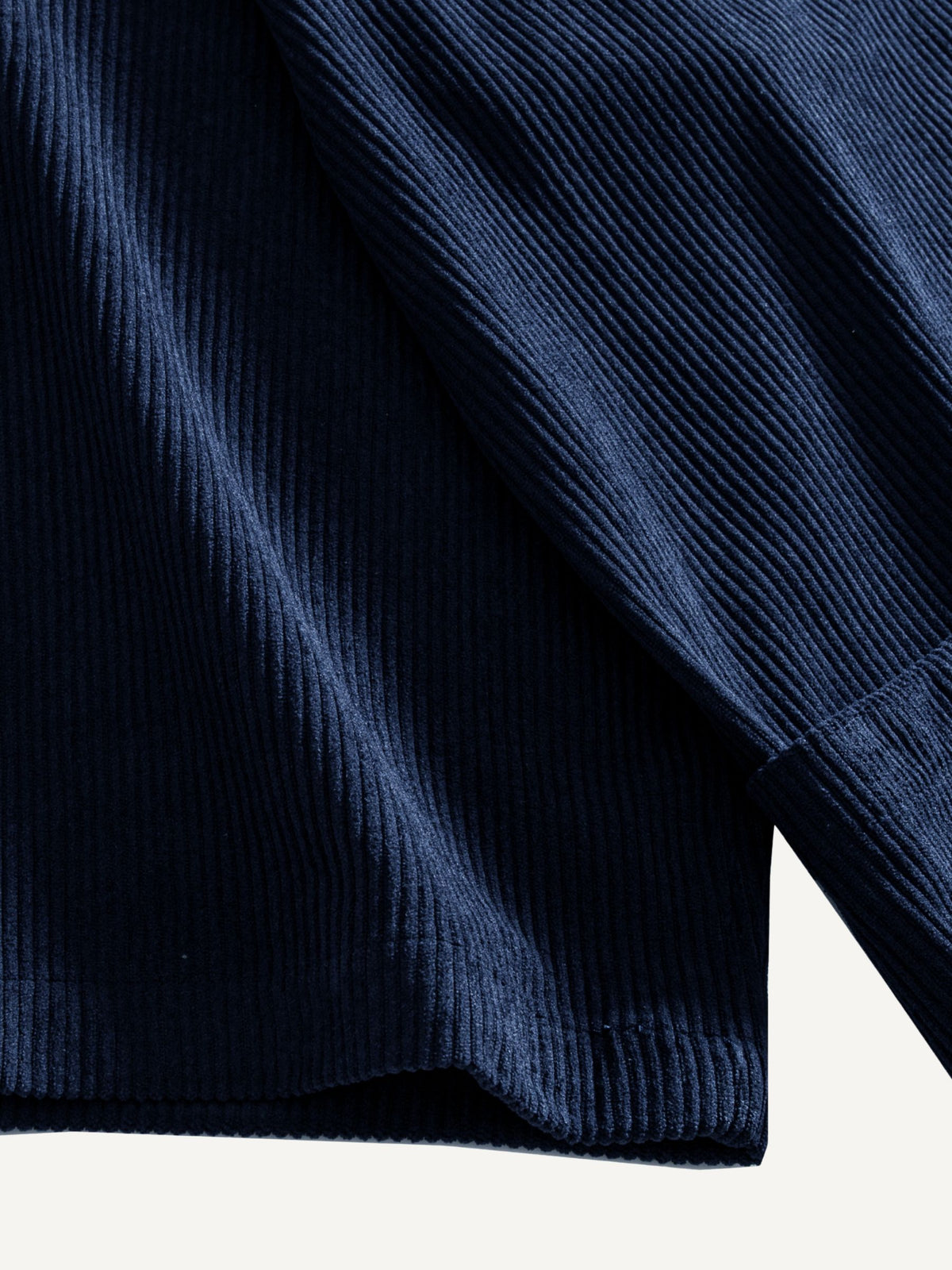 Close-up of the wide sleeve cuff and pleated finish