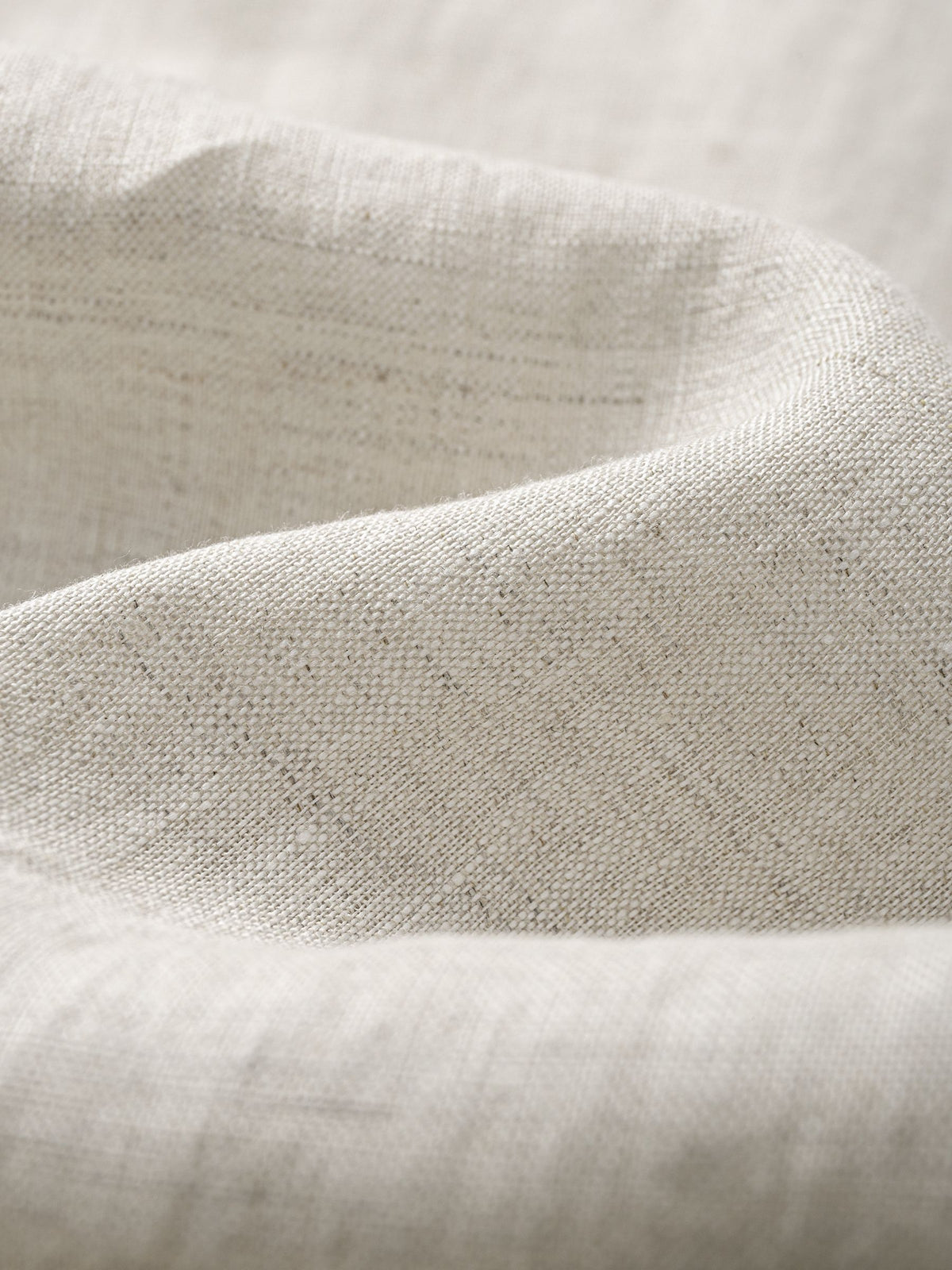 Close-up texture of 100% slub linen crosshatch weave on OROMEN Crosshatch Weave Relaxed Trousers