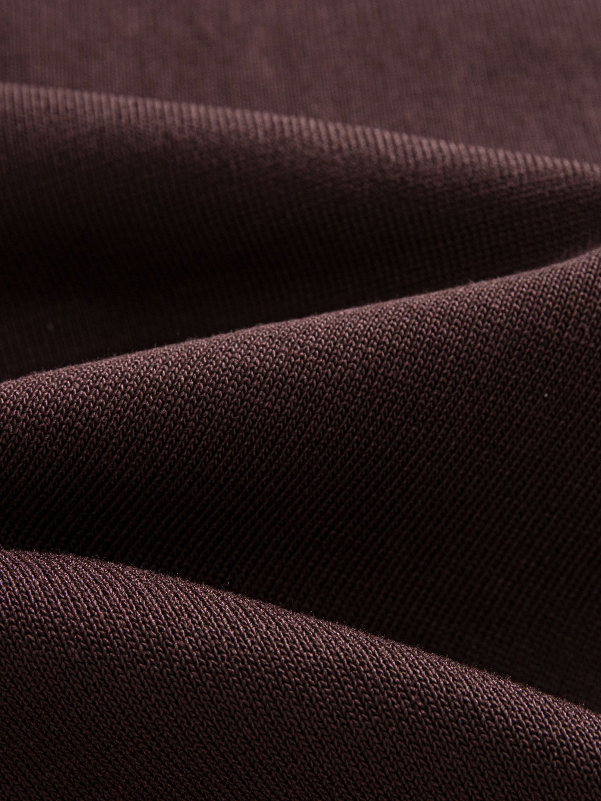 Close-up texture of ice silk viscose knit fabric on OROMEN Casa Mocha Knit Polo