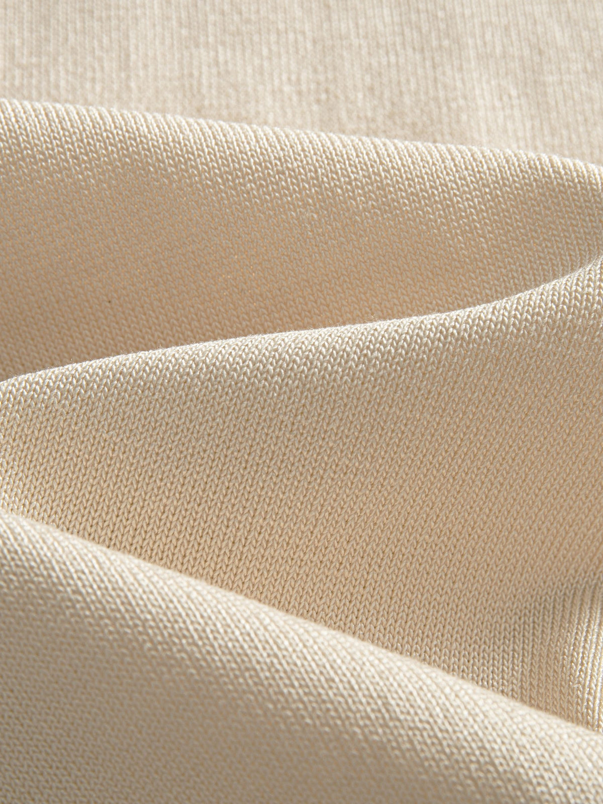 Close-up texture of ice silk viscose knit fabric on OROMEN Toasted Trim Knit Polo