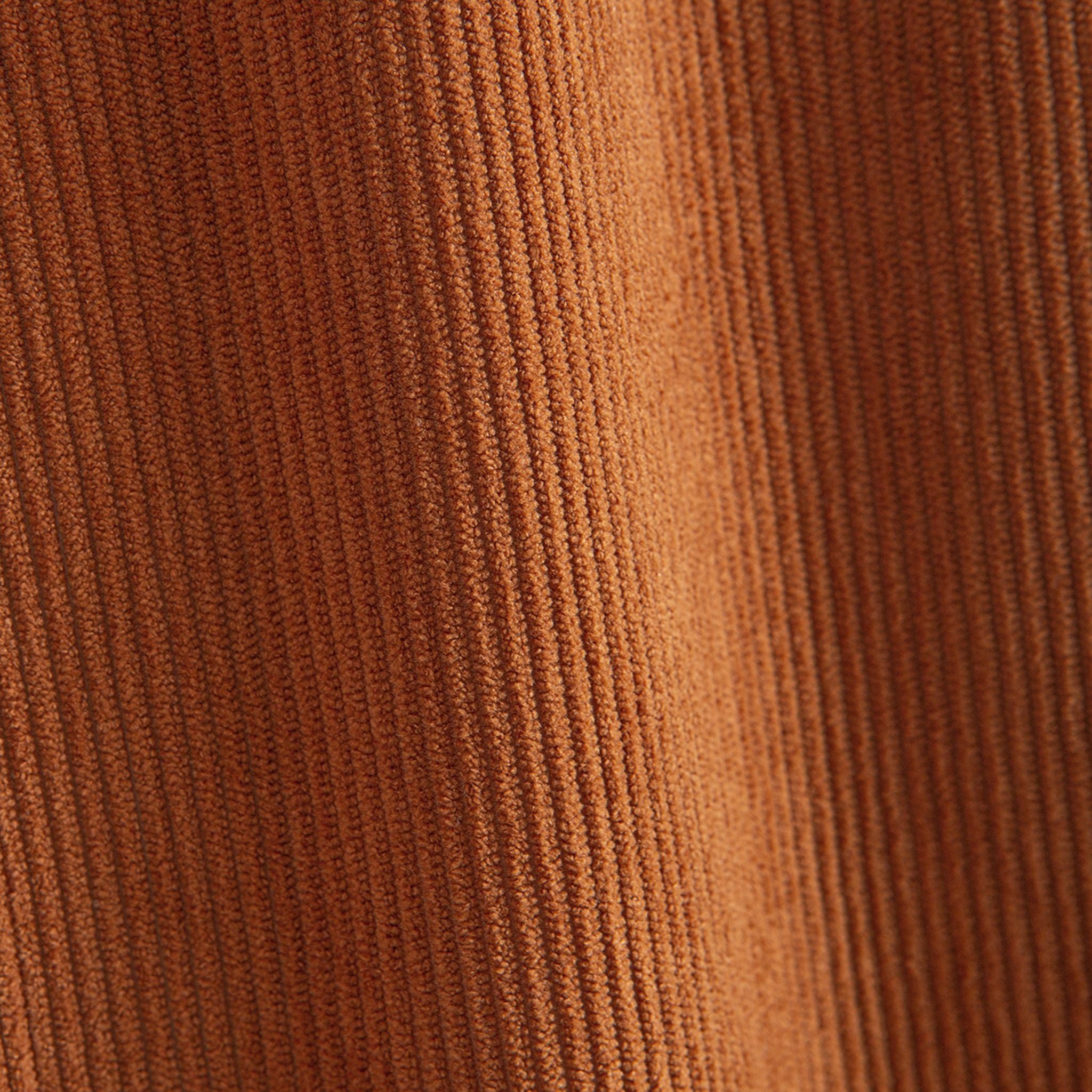 Close-up of rust polyester corduroy ribbed texture on OROMEN colorblock hooded shirt