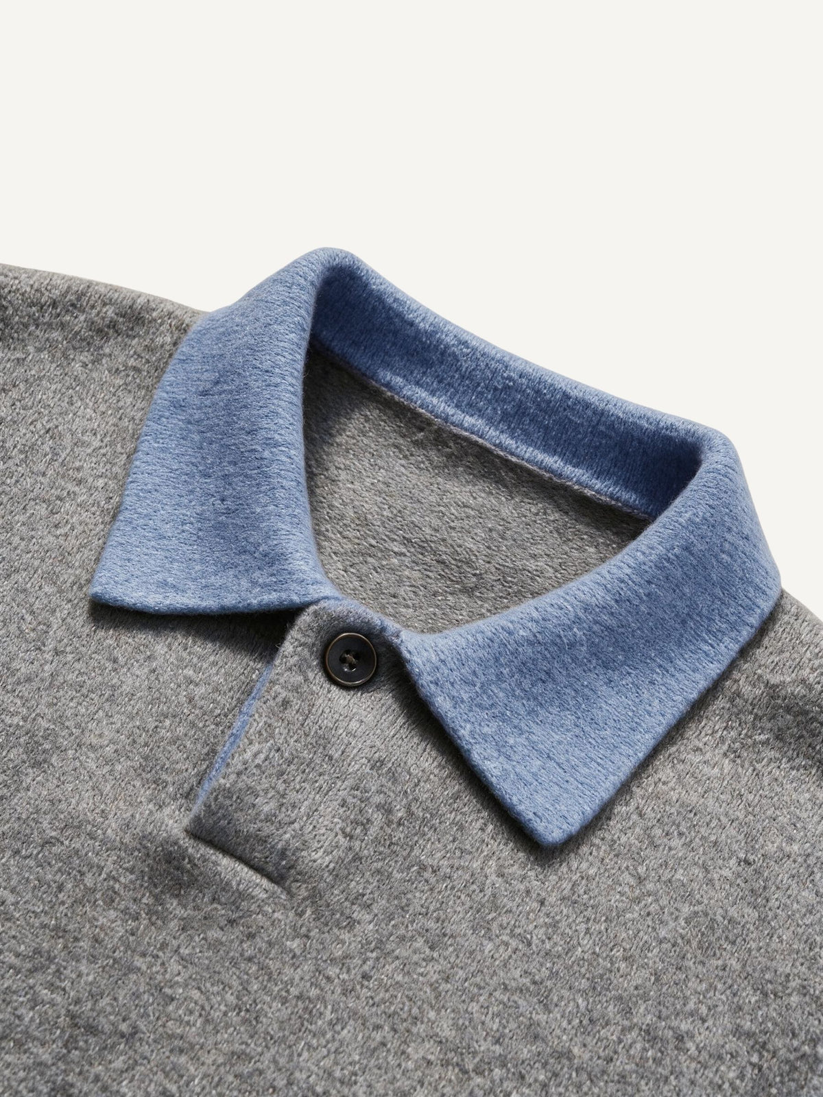 Contrast polo collar and single-button placket detail of OROMEN Two-Tone Collar Knit Sweater