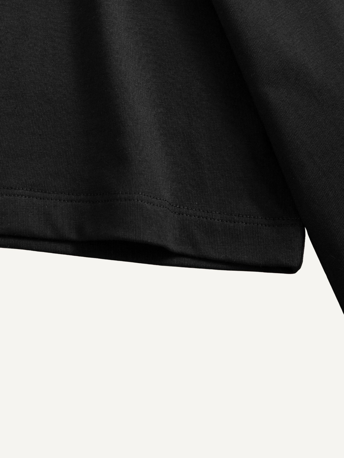 Double-stitched sleeve cuff and seam detail of OROMEN Melting Cube Embroidery T-shirt