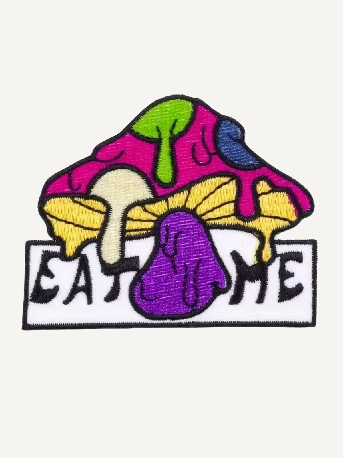 Embroidered Eat Me wild mushroom artwork detail on OROMEN T-shirt