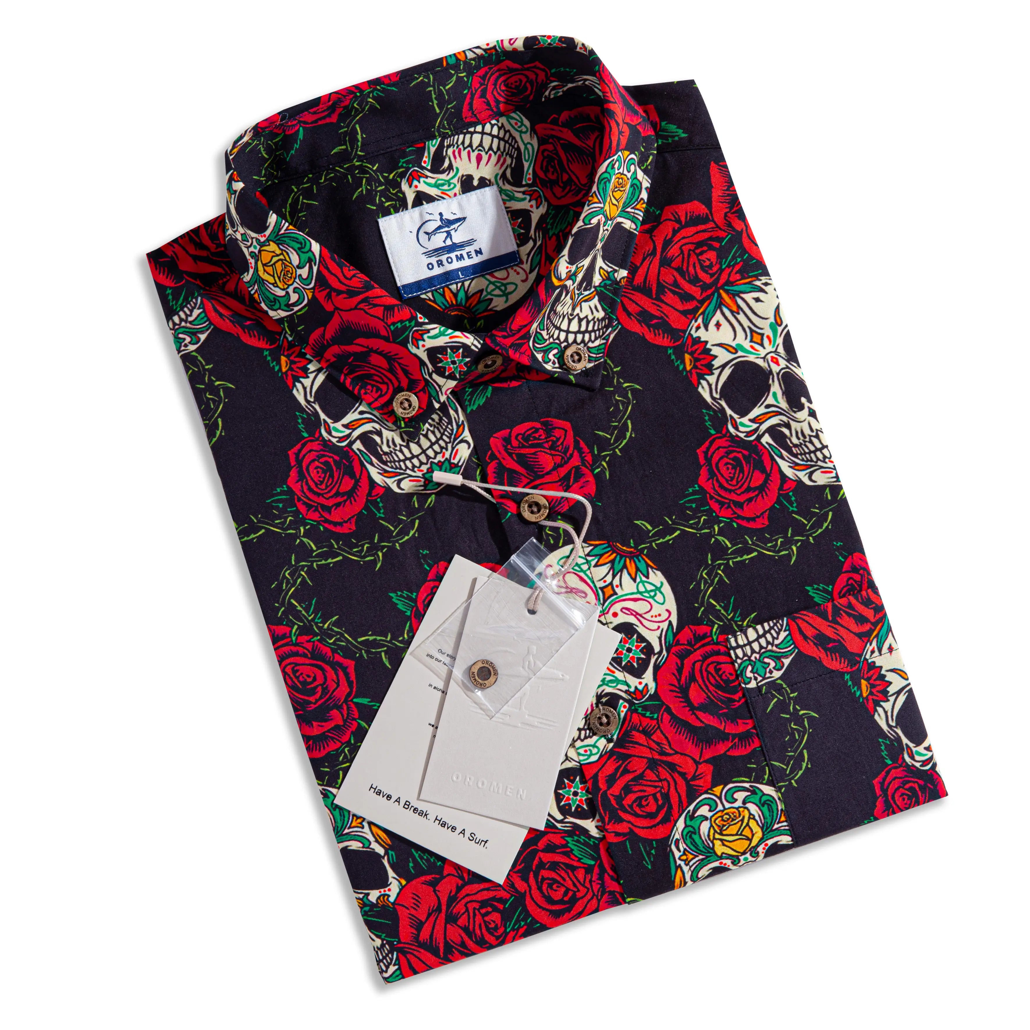 Folded OROMEN Bloom And Death Hawaiian shirt with hang tag – black sugar skull and red rose print, ready to gift