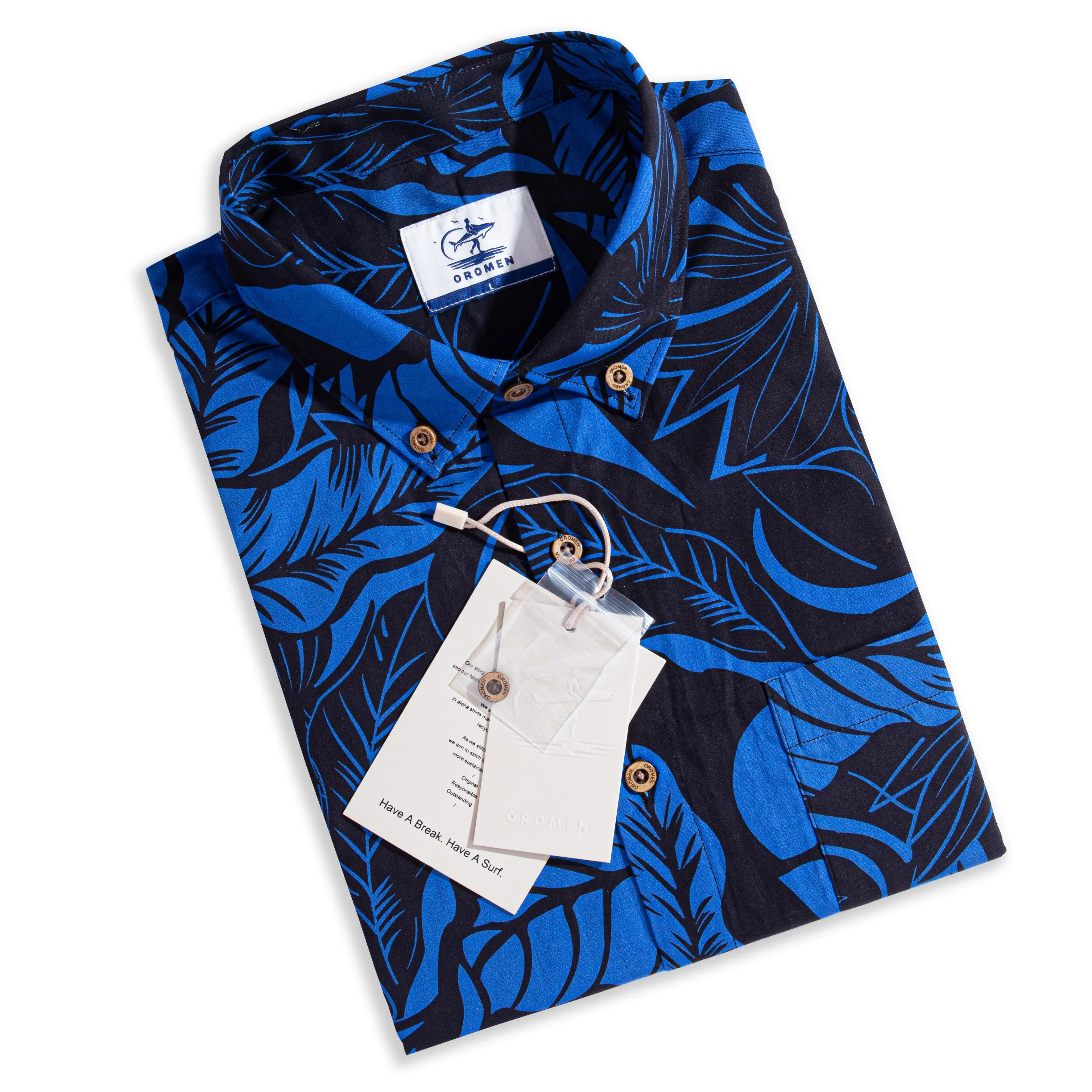 Folded OROMEN Blue Bush Hawaiian shirt with hang tag – navy tropical leaf print, ready to gift