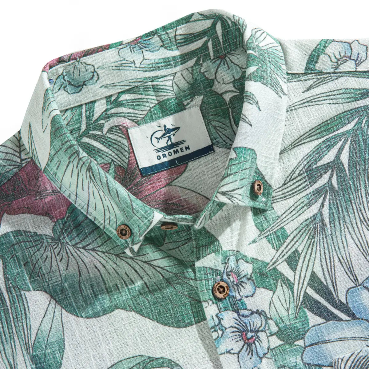 Hand-painted summer flowers and foliage detail on green linen aloha shirt