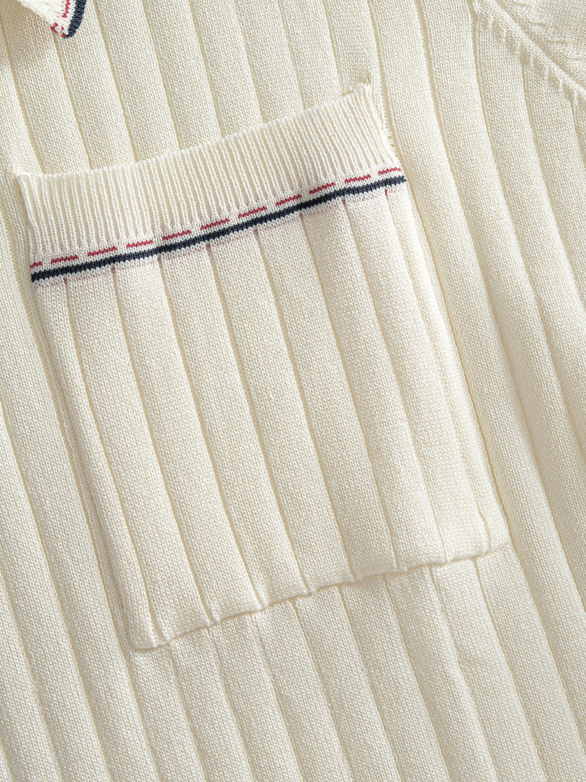 Left chest pocket detail on OROMEN Cream Court Knit Polo