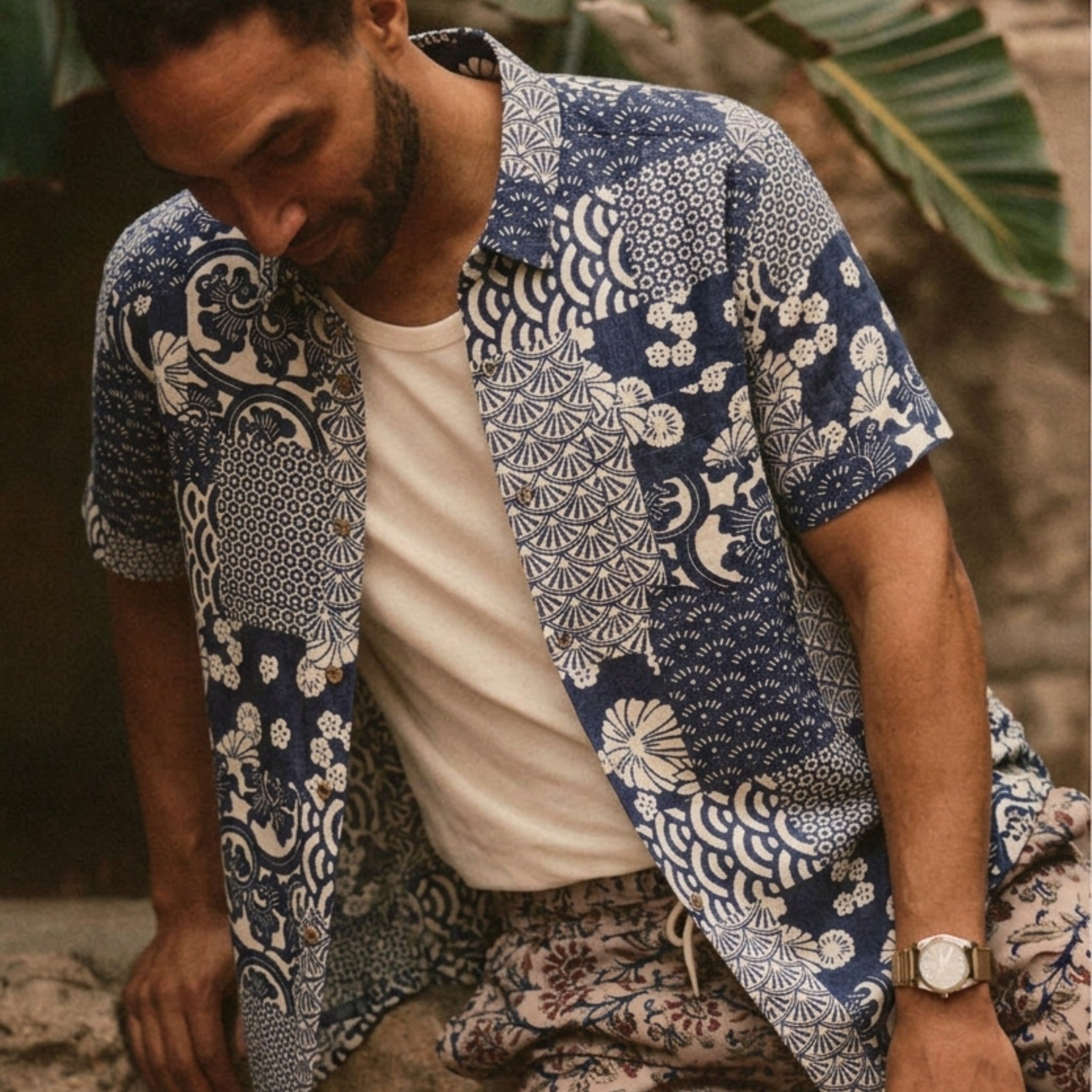 Man wearing a navy blue Japanese Ukiyoe collage print aloha shirt