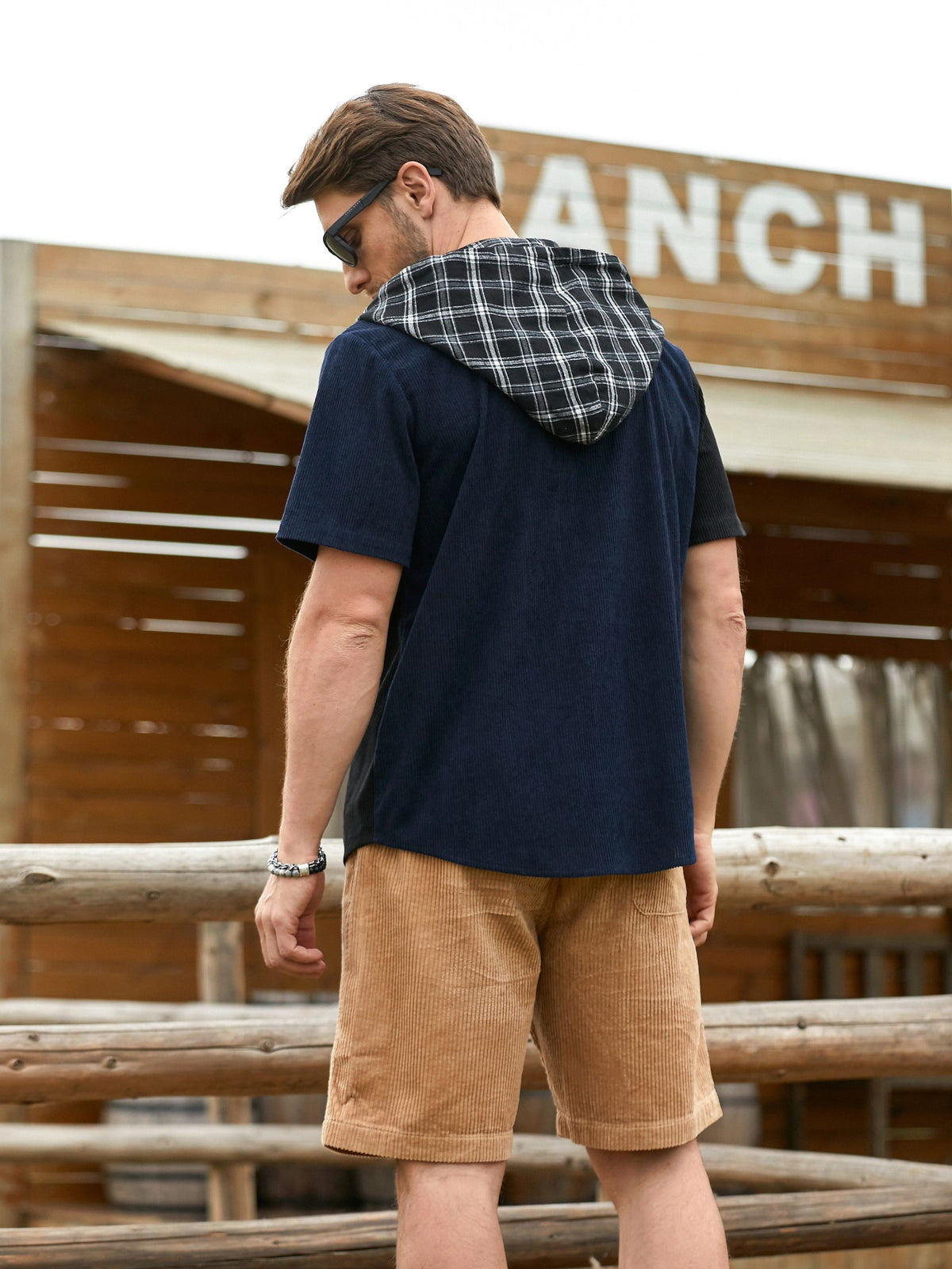 Model standing wearing OROMEN Lodge Corduroy Hooded Shirt