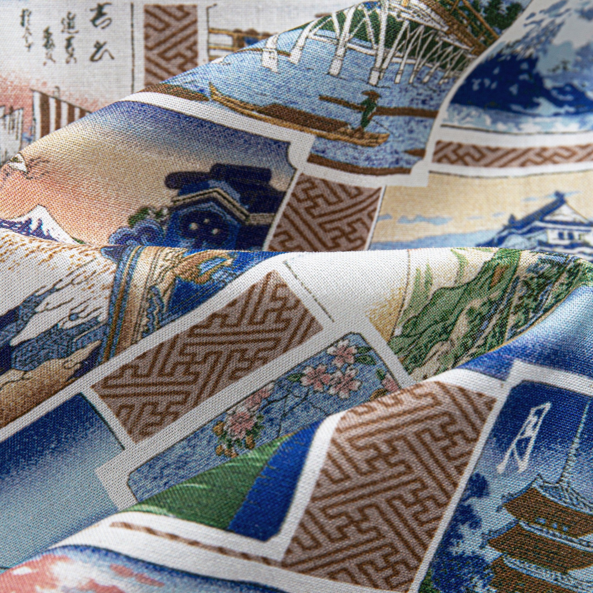 Model wearing Postcard Collage Japanese aloha shirt with button-down collar and coconut buttons