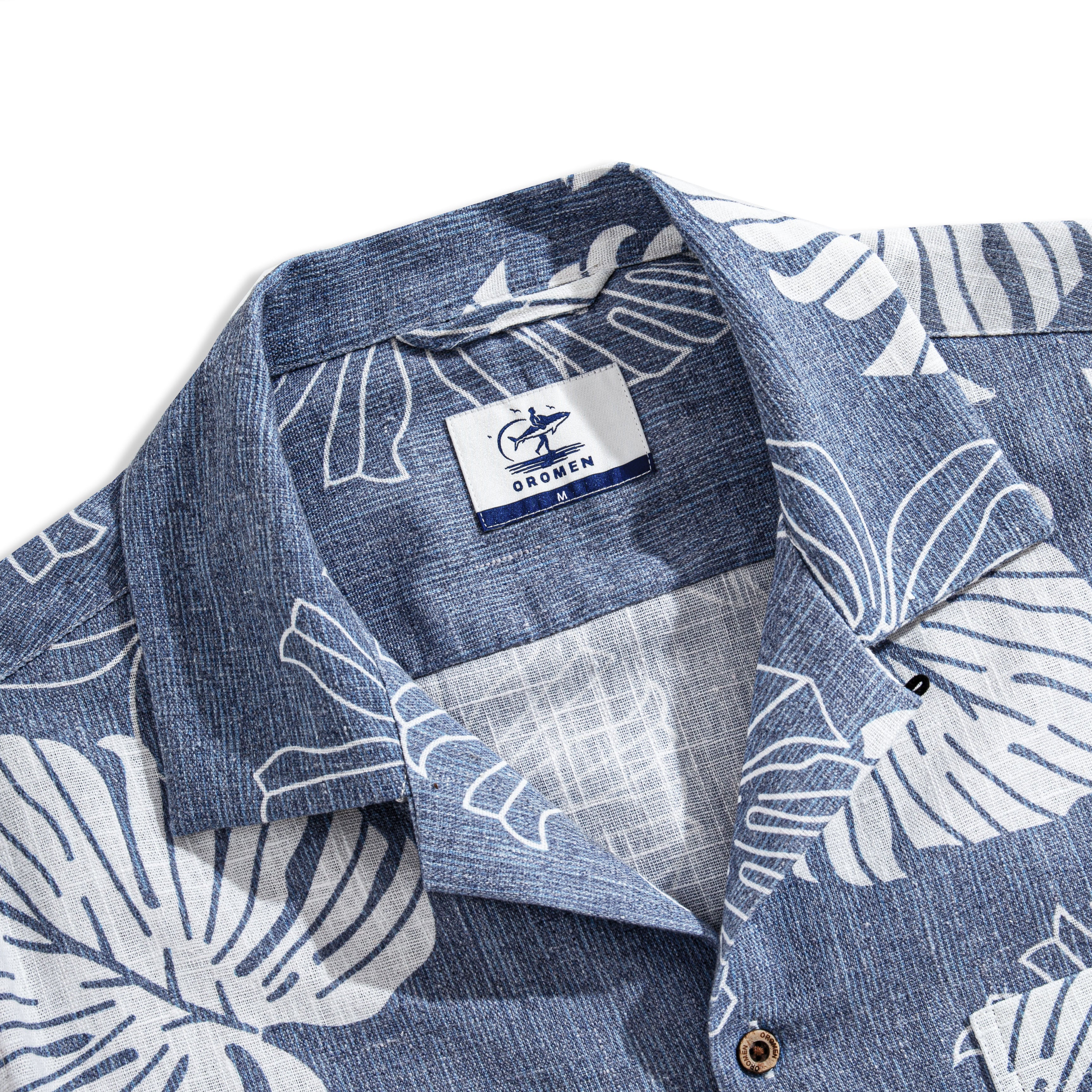 Monstera Deliciosa shirt close-up showing hand-painted botanical leaf details