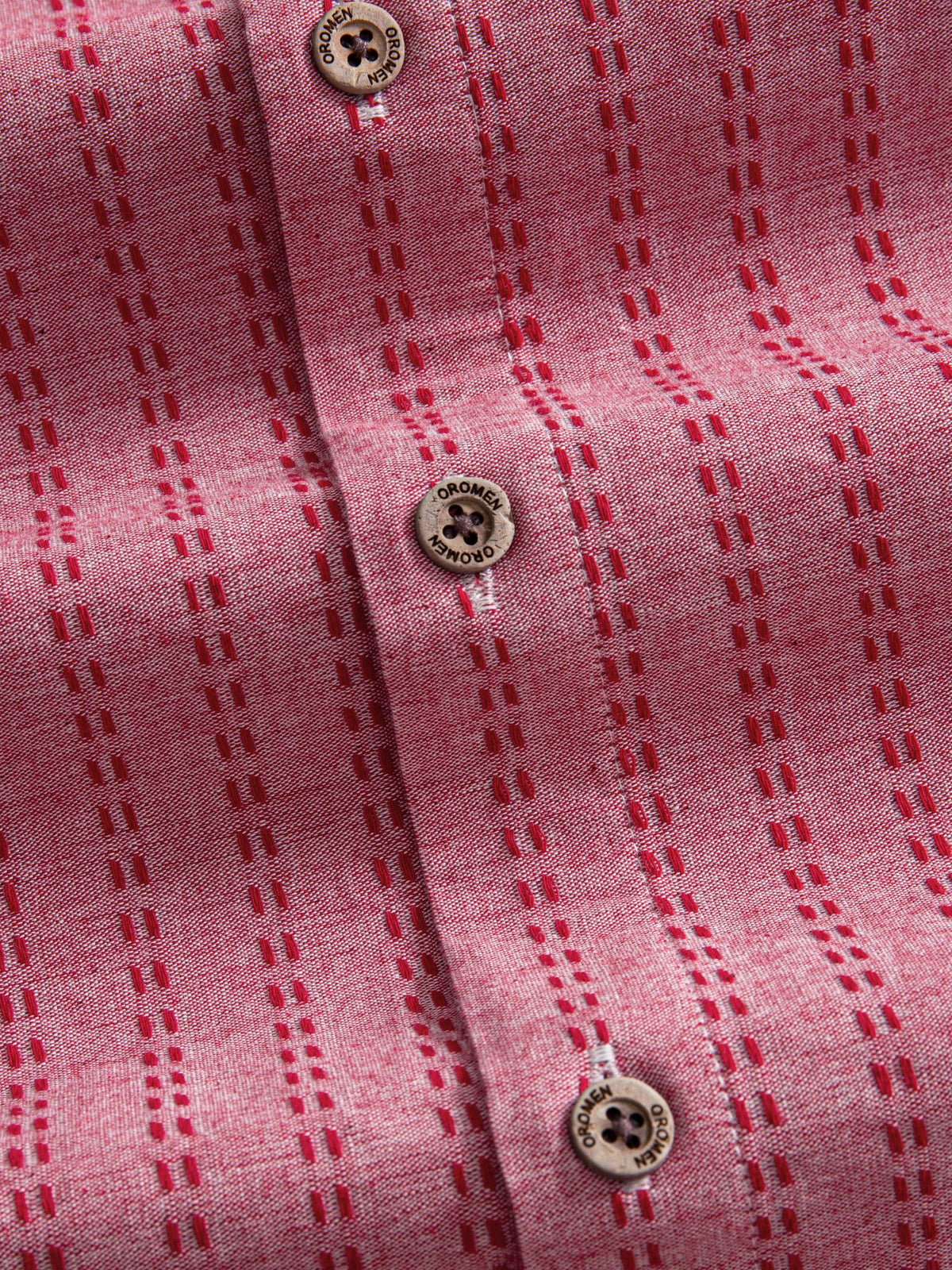 Natural coconut button closure and front placket detail of OROMEN Sashiko Coral Cotton Shirt
