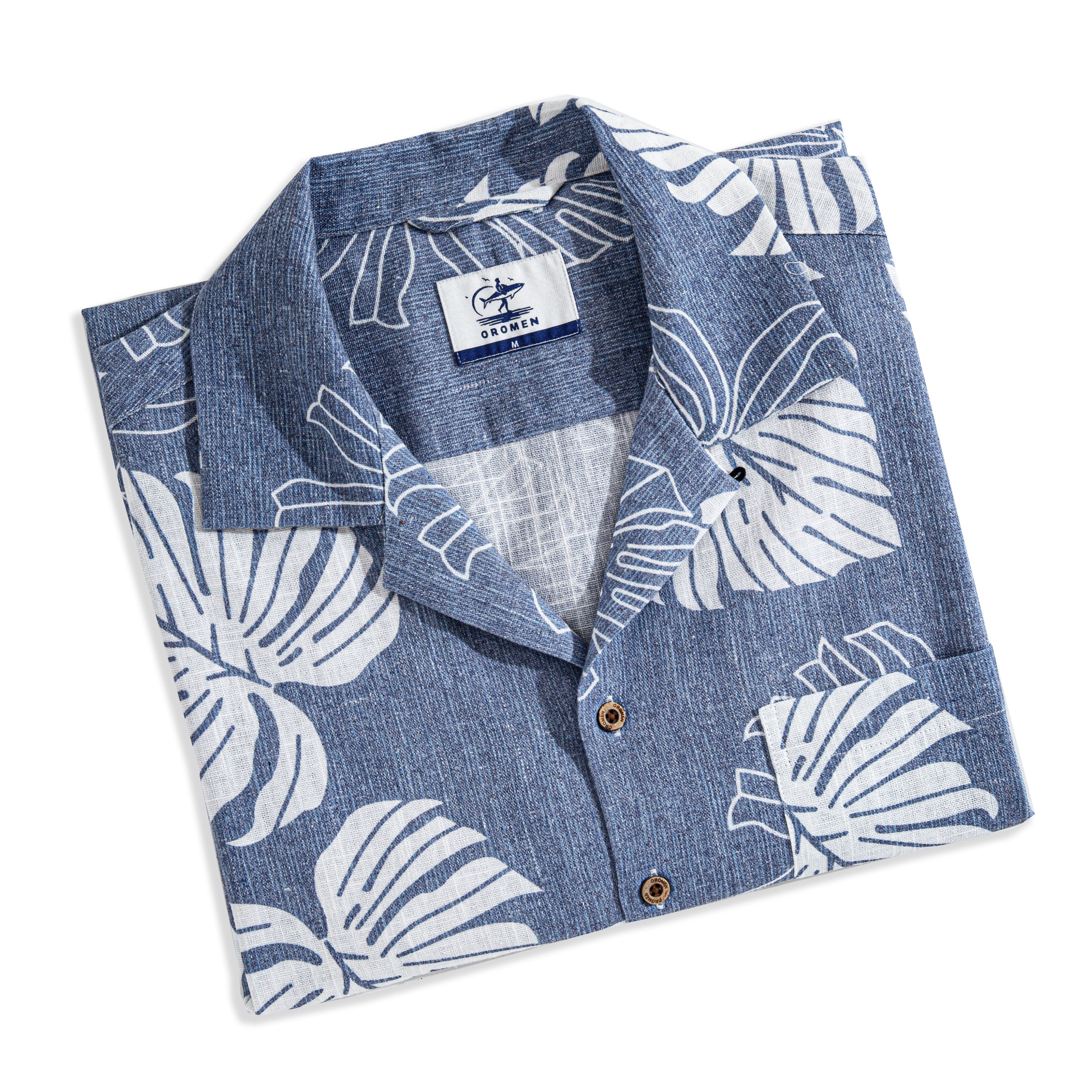Navy blue linen camp collar shirt with Monstera print - front view on model