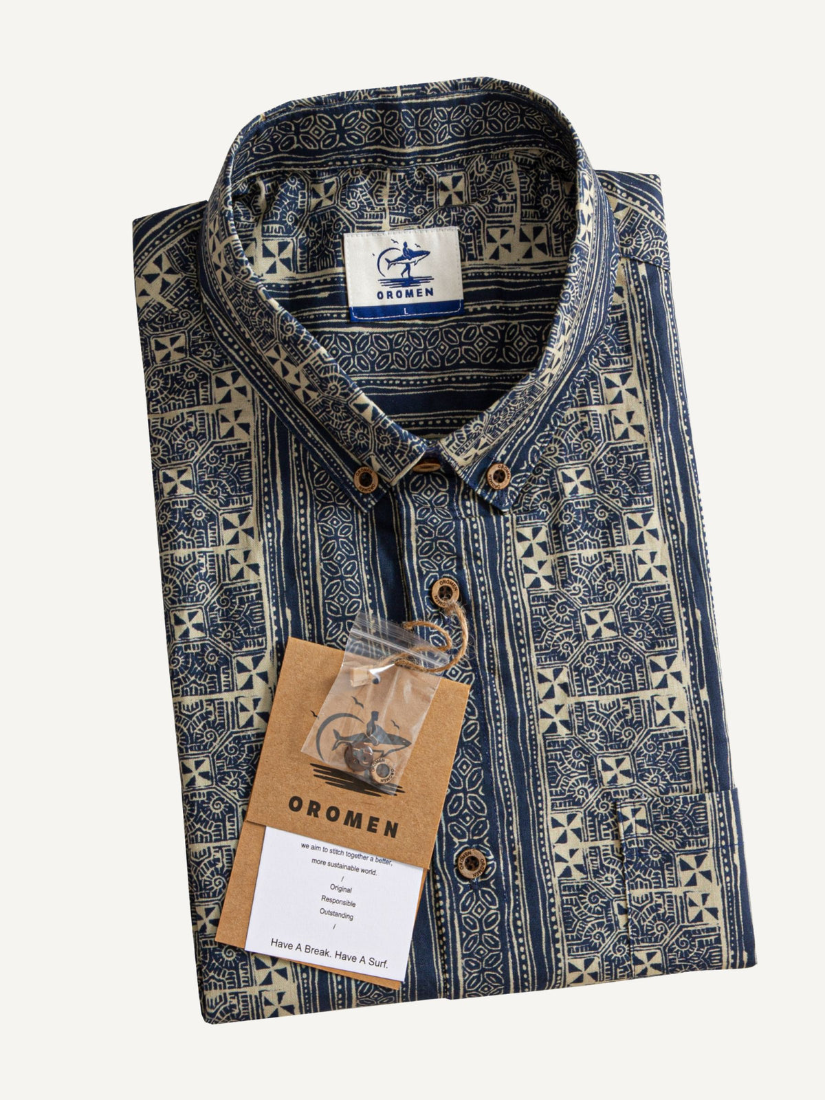 Neatly folded presentation of OROMEN Indigo Batik Shirt