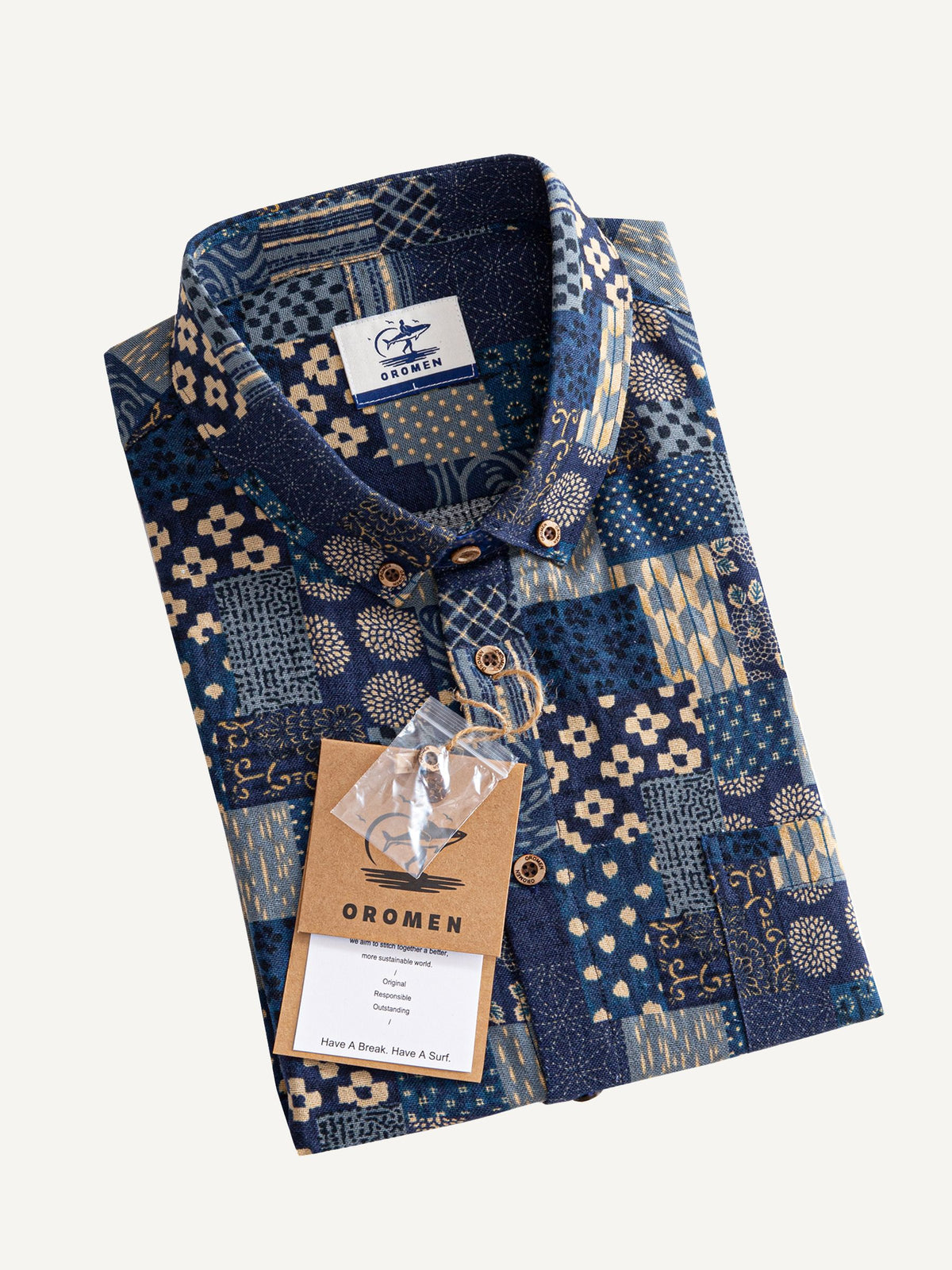 Neatly folded presentation of OROMEN Patchwork-Print Long-Sleeve Shirt