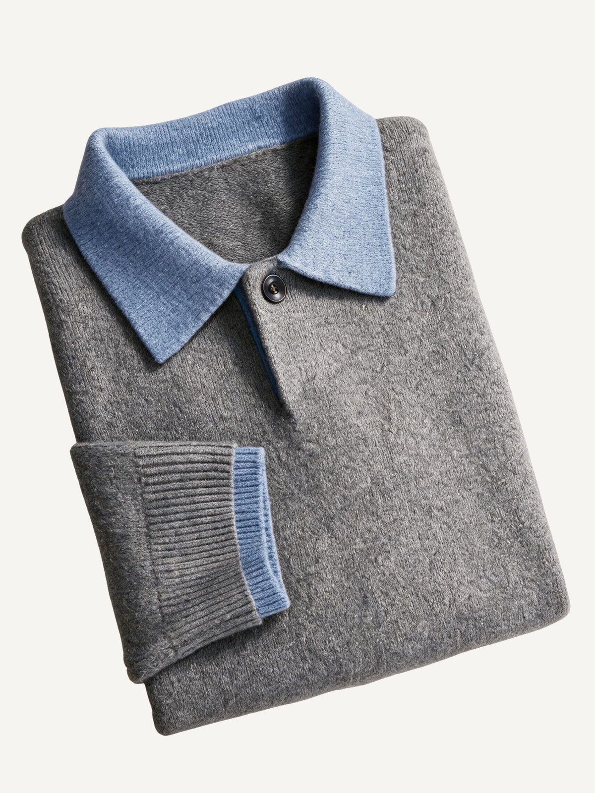 Neatly folded presentation of OROMEN Two-Tone Collar Knit Sweater