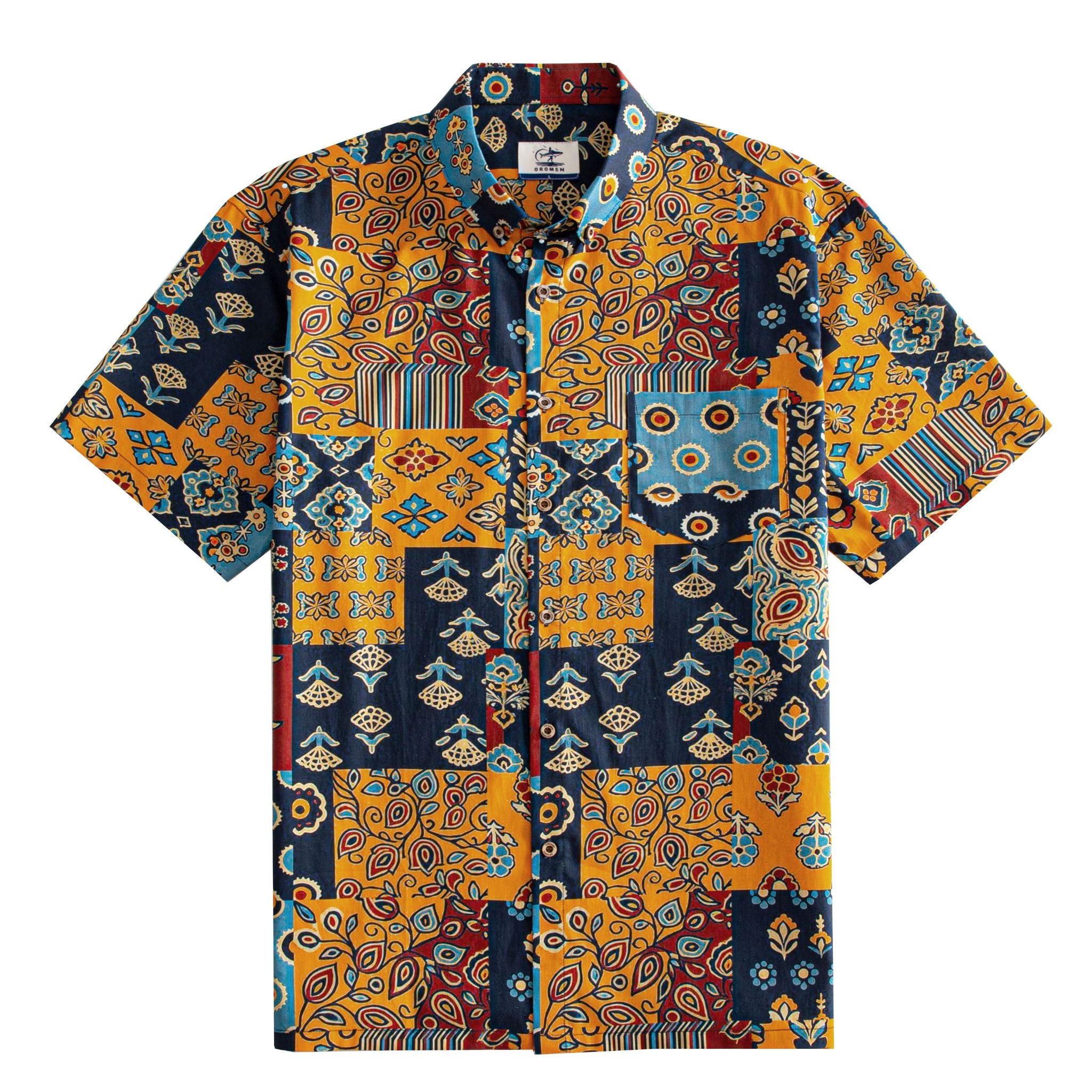 OROMEN Ajrakh Mosaic Hawaiian shirt front flat lay showing full allover patchwork block layout with paisley, sun circles, folk birds and floral motifs in navy, amber, slate blue and burgundy