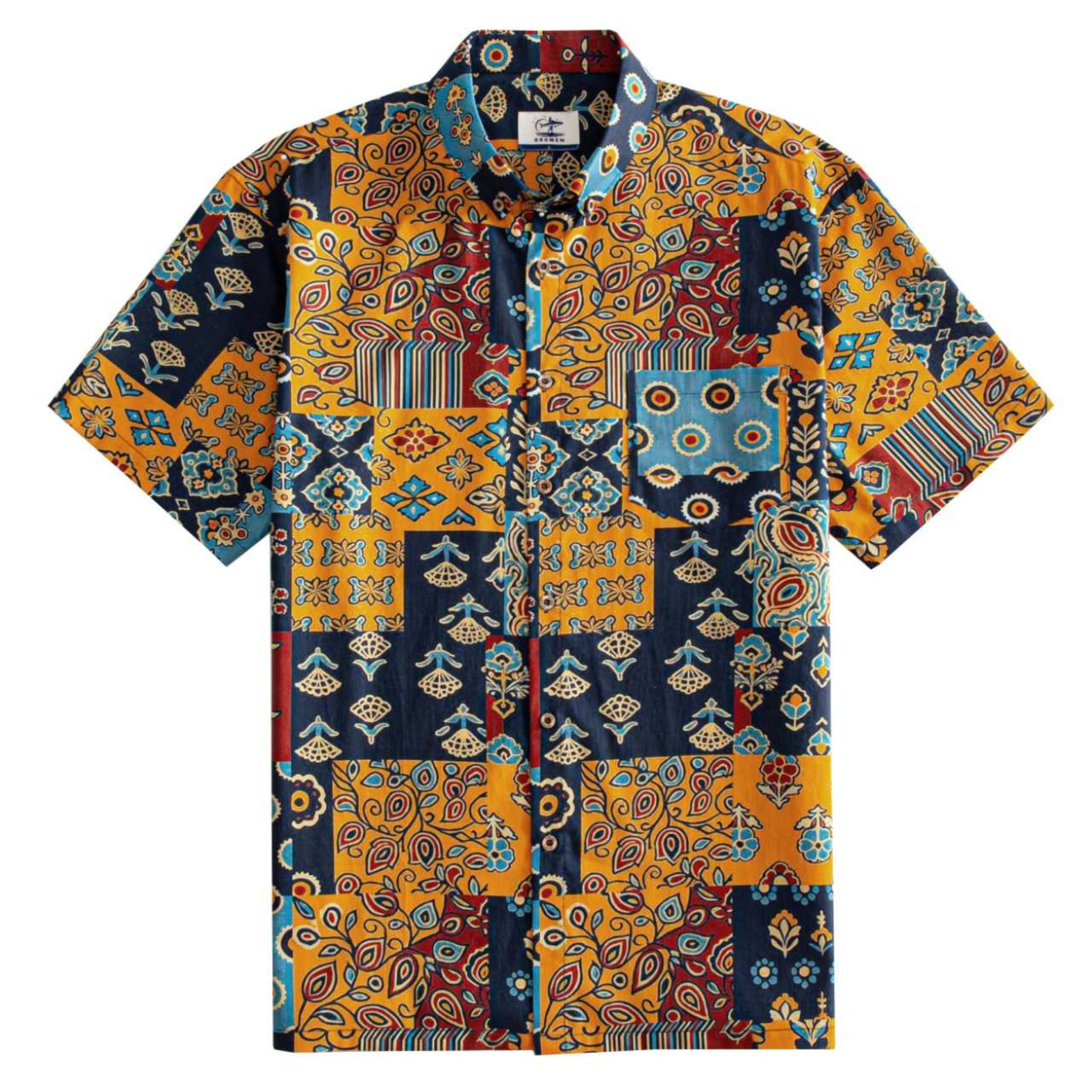 OROMEN Ajrakh Mosaic Hawaiian shirt front flat lay showing full allover patchwork block layout with paisley, sun circles, folk birds and floral motifs in navy, amber, slate blue and burgundy
