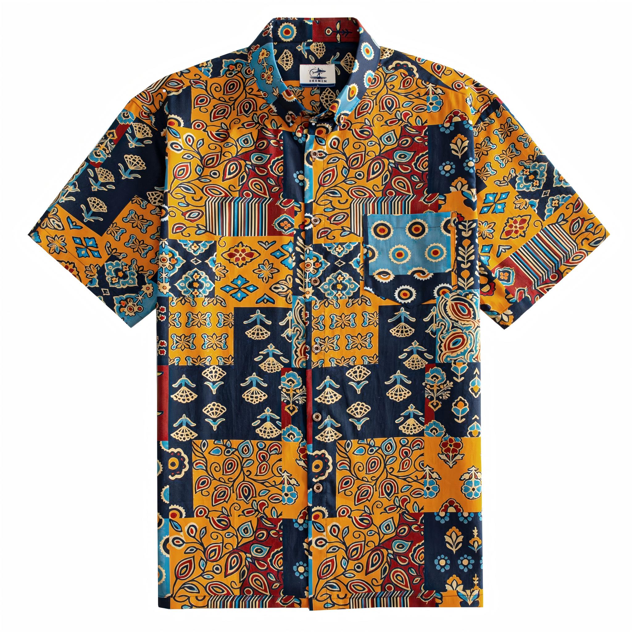 OROMEN Ajrakh Mosaic Hawaiian shirt front flat lay showing full allover patchwork block layout with paisley, sun circles, folk birds and floral motifs in navy, amber, slate blue and burgundy