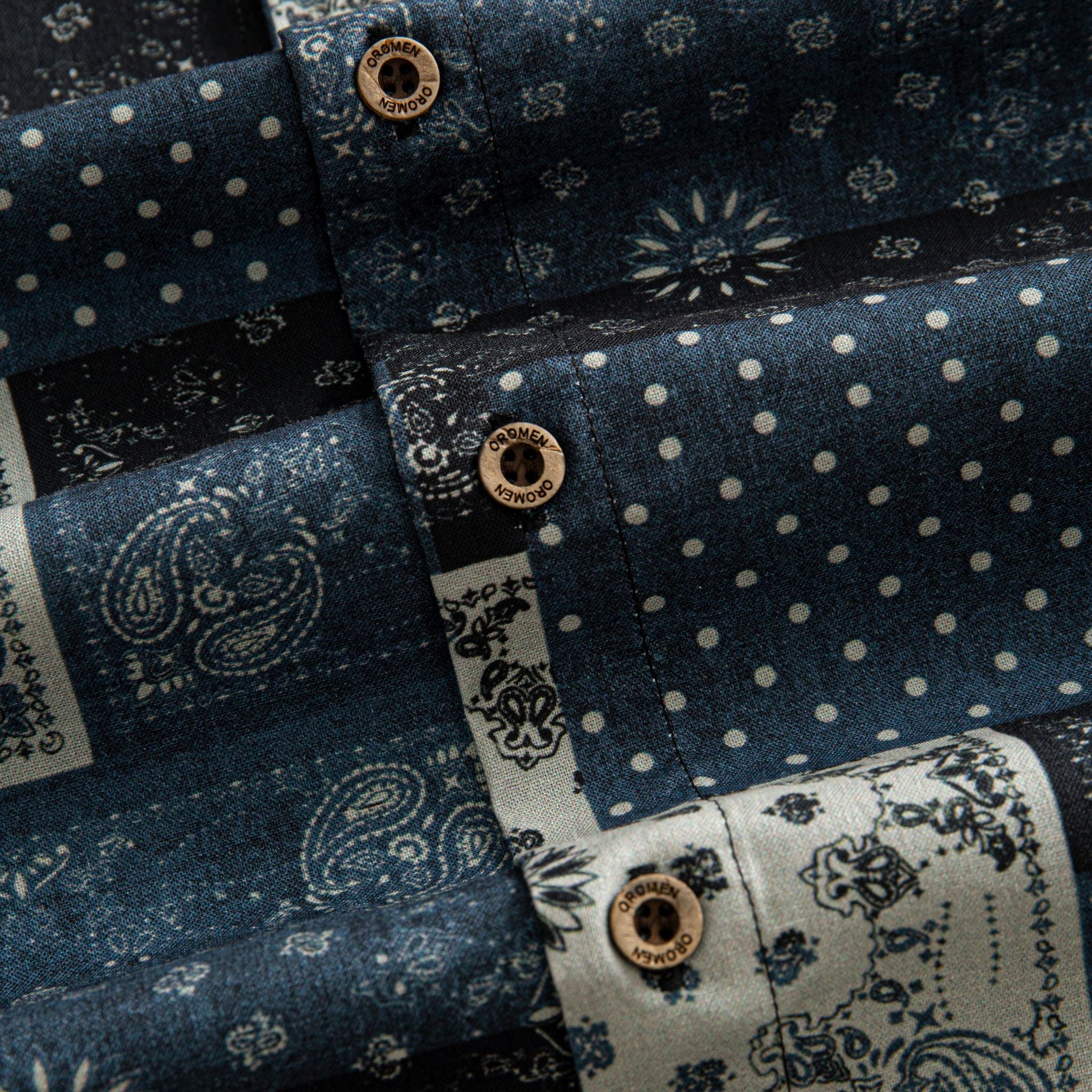 OROMEN Bandana Patchwork shirt branded coconut button close-up, indigo and black paisley bandana patchwork