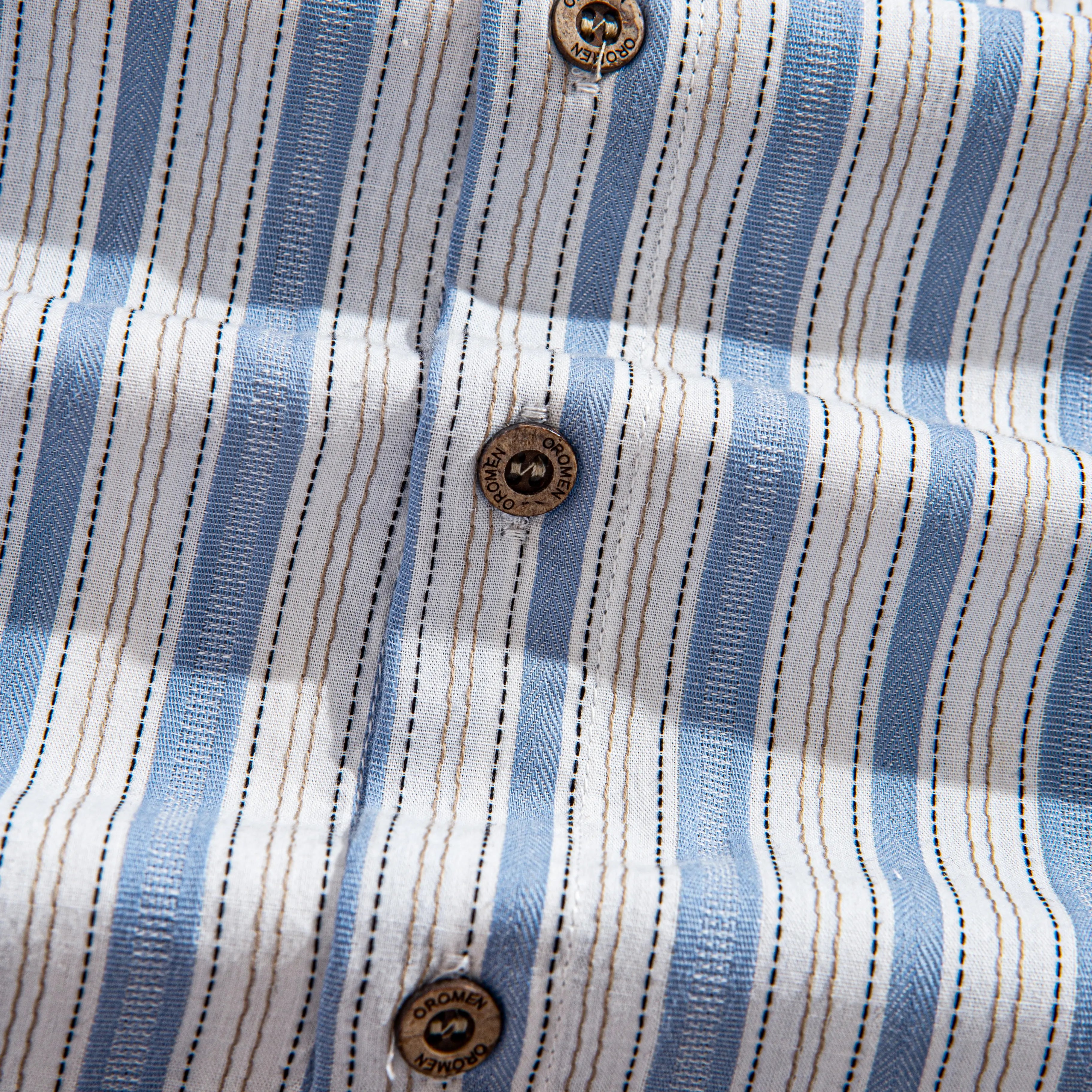 OROMEN Blue Ribbon Striped Shirt – Natural Coconut Buttons Close-Up