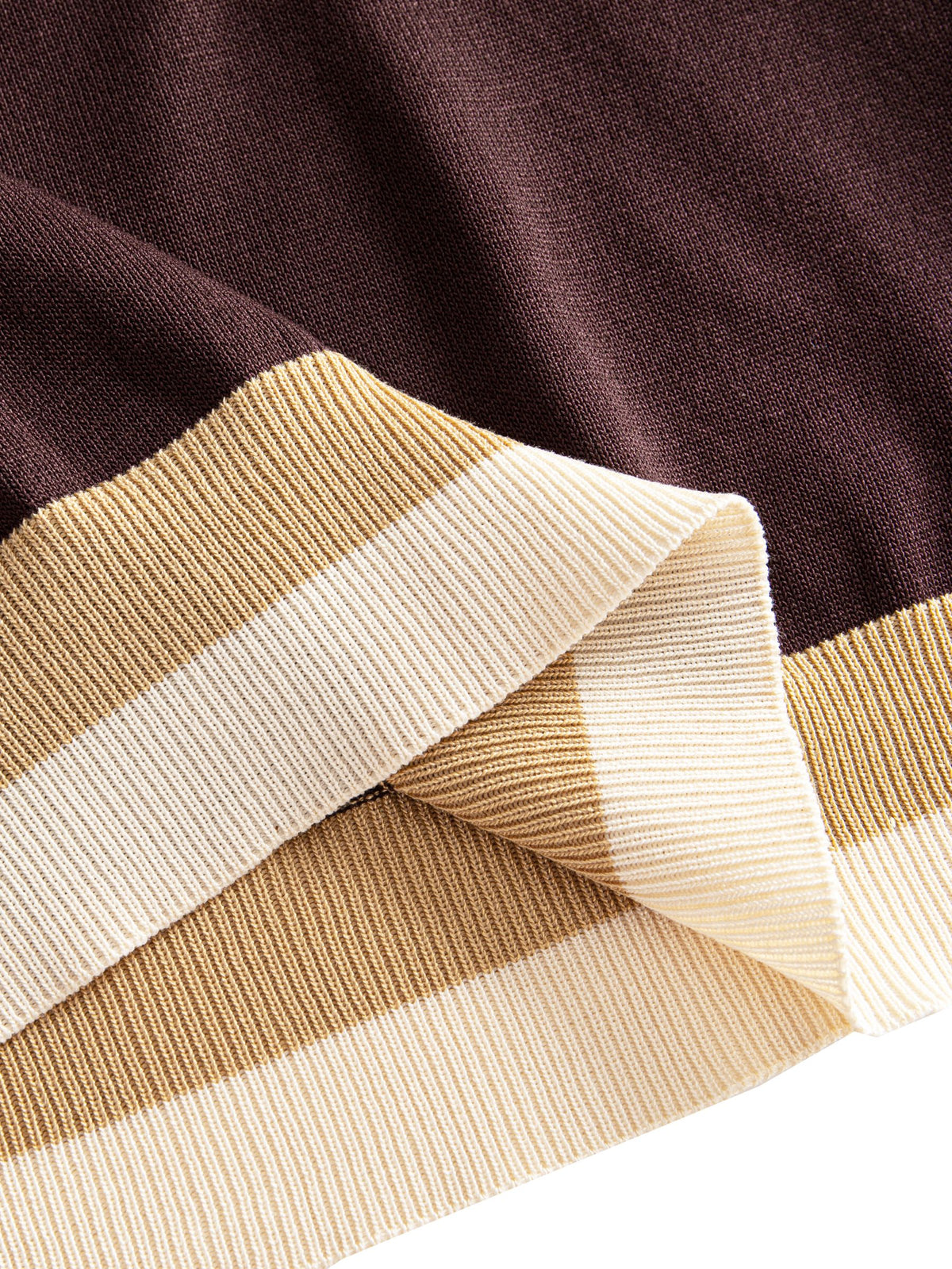 OROMEN Casa Mocha Knit Polo hem detail showing structured ribbed trim with contrast color blocking