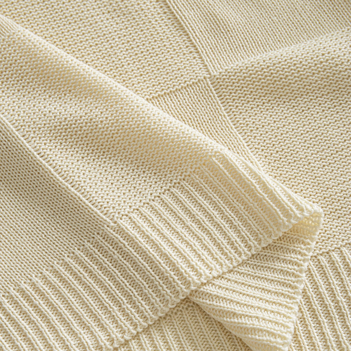 OROMEN Checkerboard Textured Sweater cream ribbed hem detail close-up