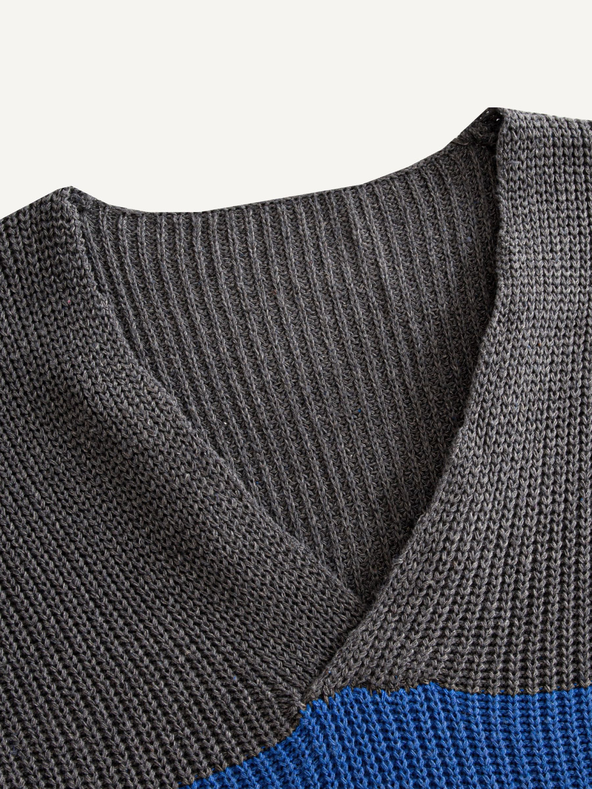 OROMEN Color-Block Striped V-Neck Sweater collar detail showing overlapping crossover ribbed V-neck