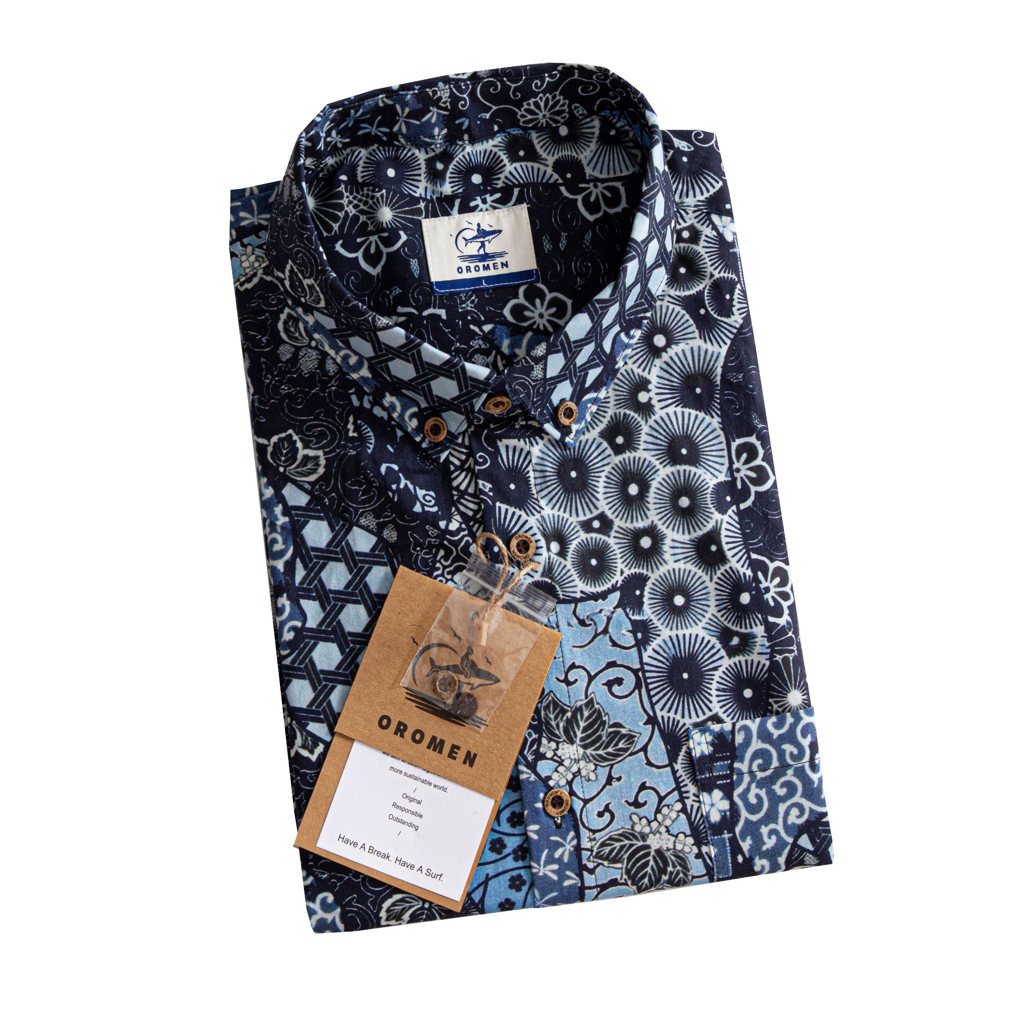 OROMEN Komon Patchwork shirt folded with branded tag and coconut buttons detail