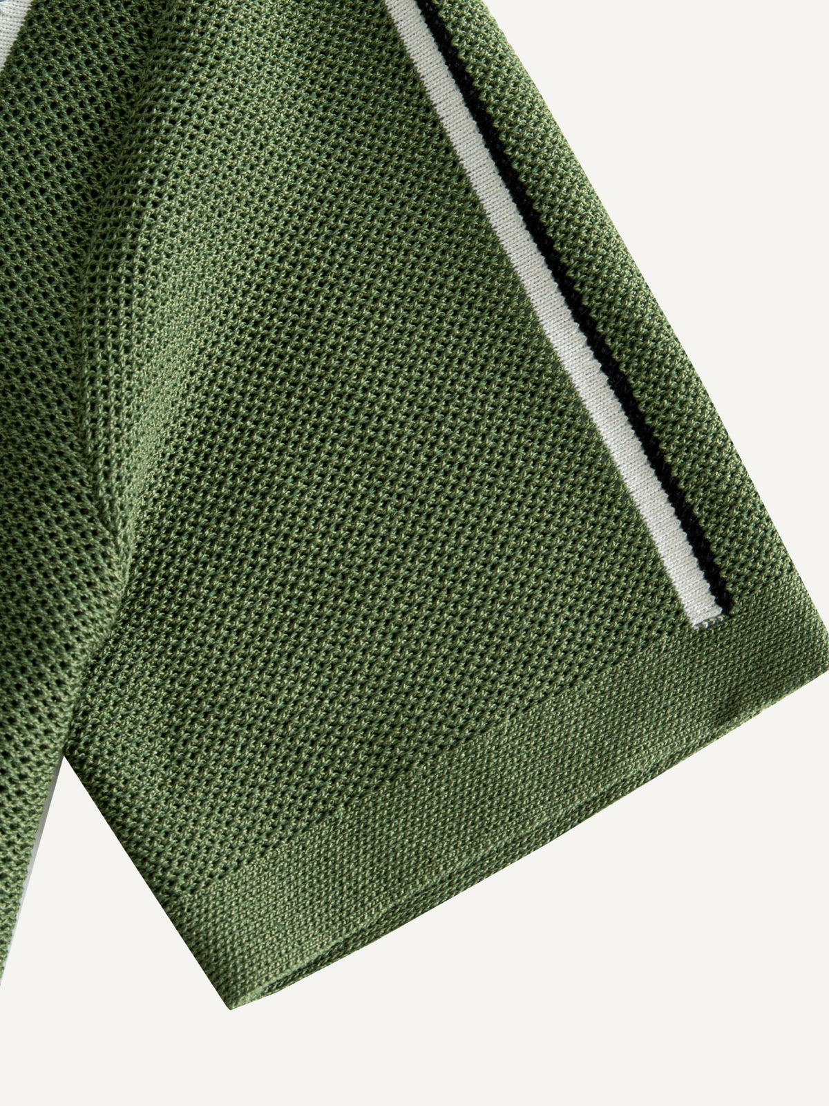 OROMEN Marcel Striped Knit Polo short sleeve cuff detail showing clean ribbed knit finish
