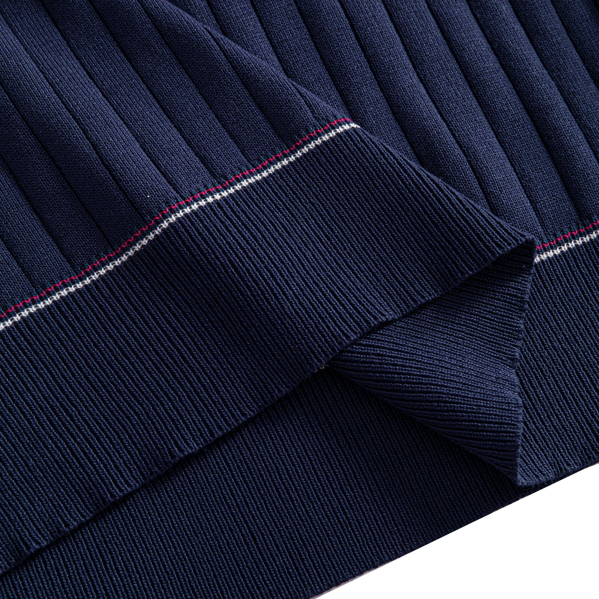 OROMEN Navy Wide-Rib Knit Polo Shirt — Hem Detail Showing Red and White Contrast Tipping and Ribbed Knit Fabric Texture