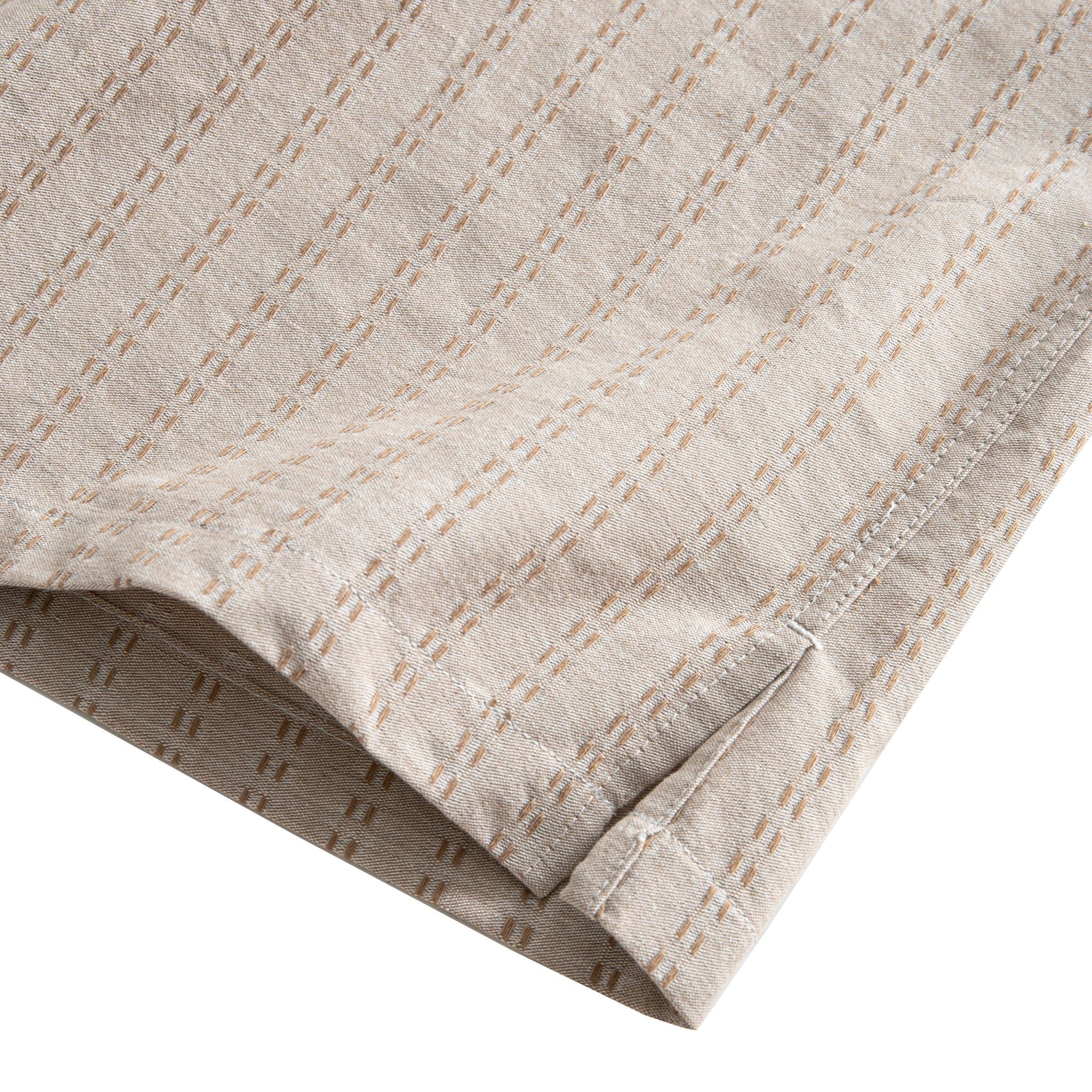 OROMEN Sashiko Natural shirt side vent and hem detail, tan Sashiko stitch with double needle stitching