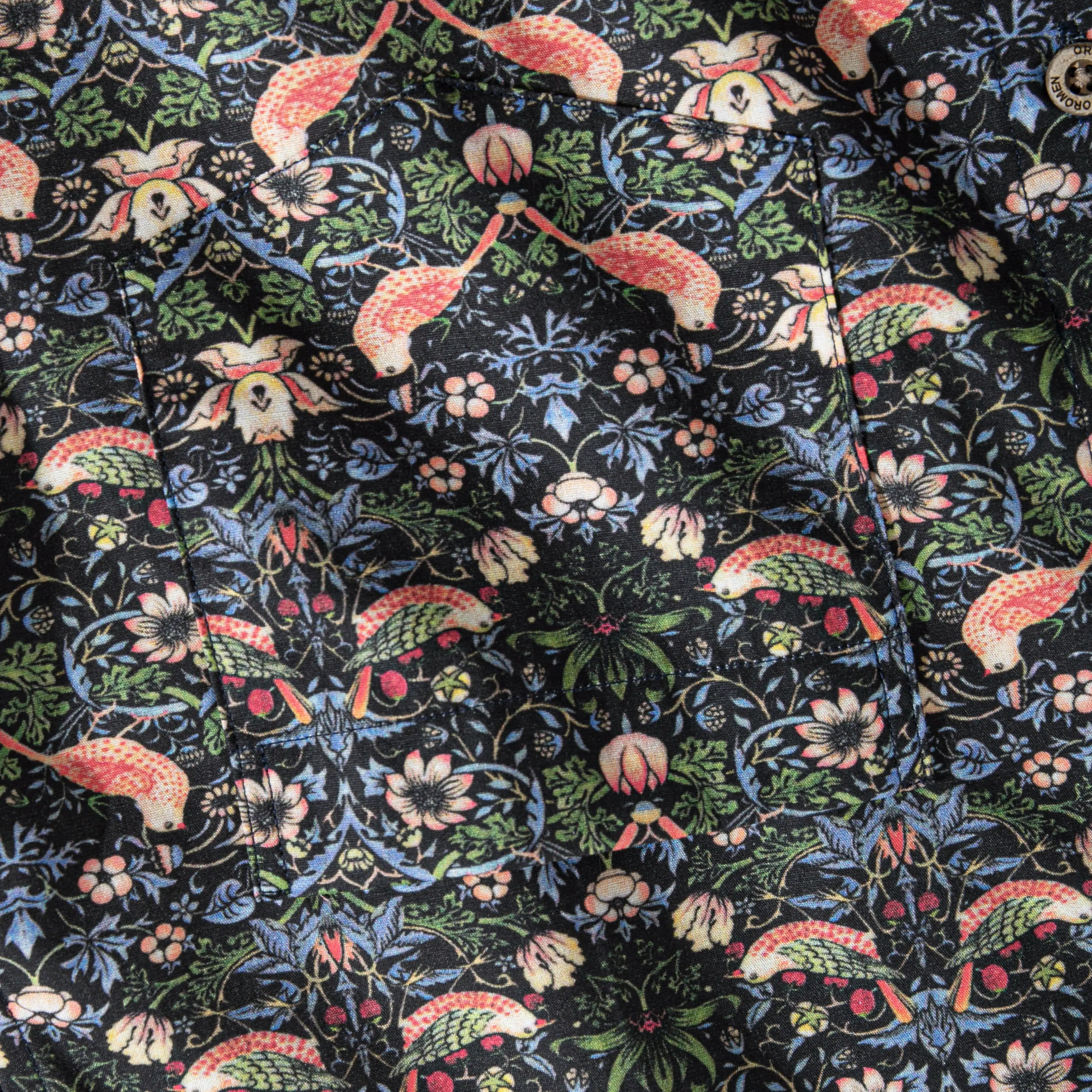 OROMEN Strawberry Thief shirt – close-up of William Morris bird and floral print fabric texture