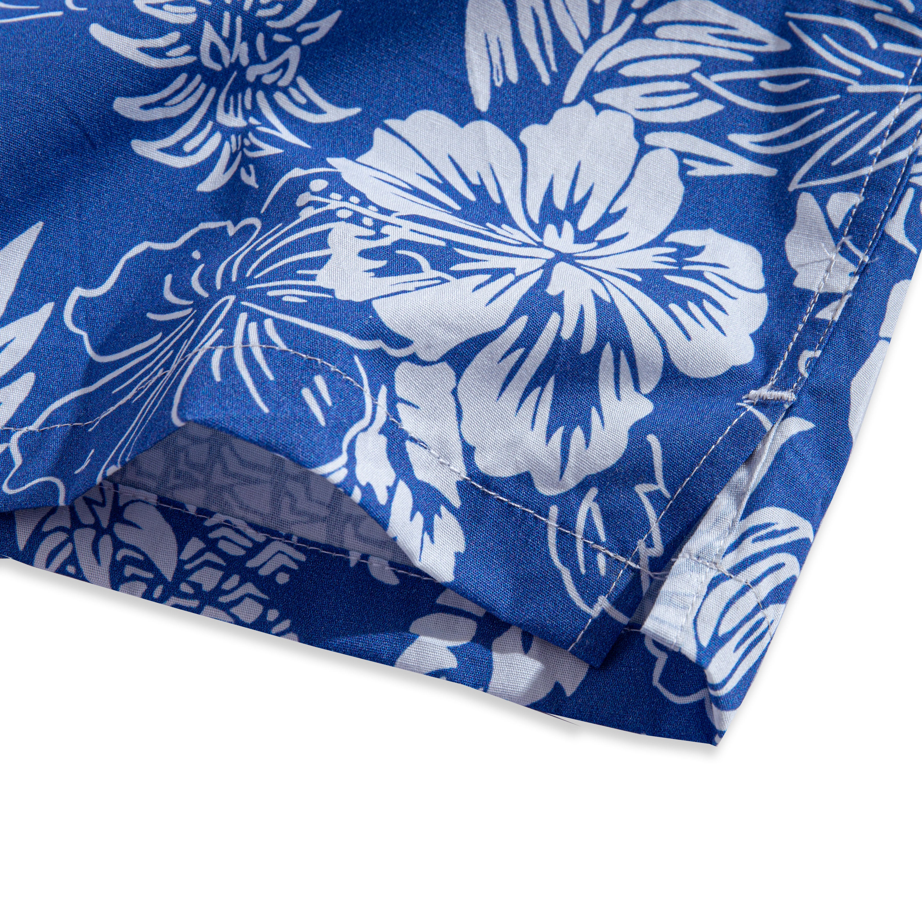 OROMEN Tropical Paradise Hawaiian Shirt – side slit hem detail with white hibiscus floral print on navy blue, showing side vent opening and double-needle stitching
