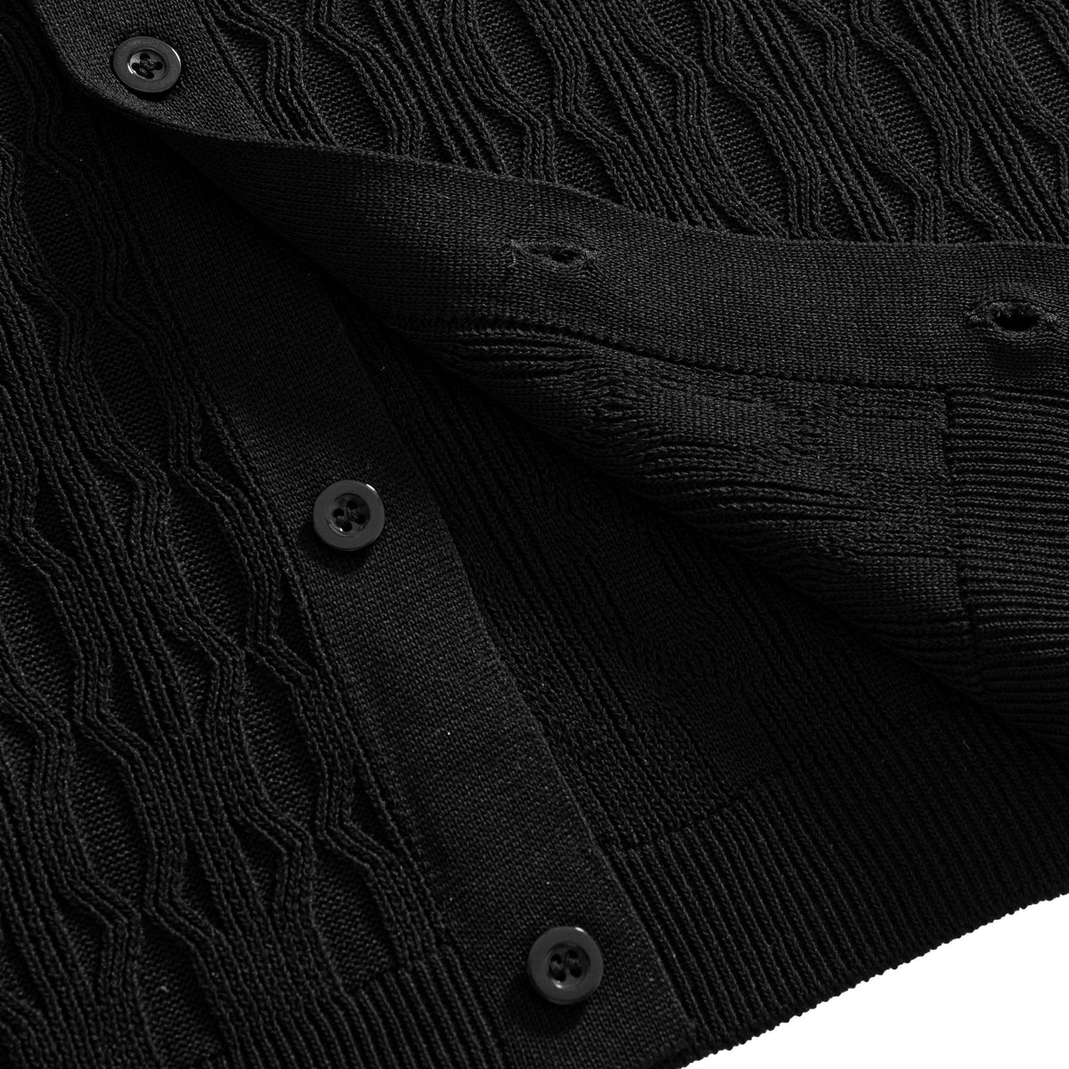 OROMEN Wave Jacquard Knit Polo black hem front center detail