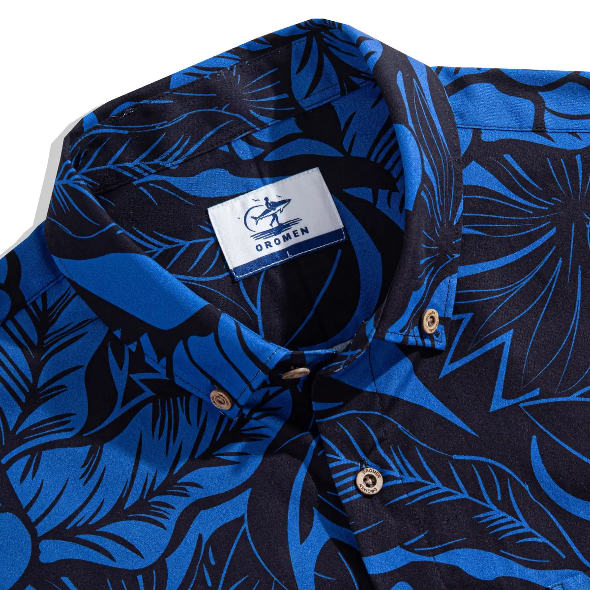 OROMEN brand label and coconut button detail on Blue Bush Hawaiian shirt collar