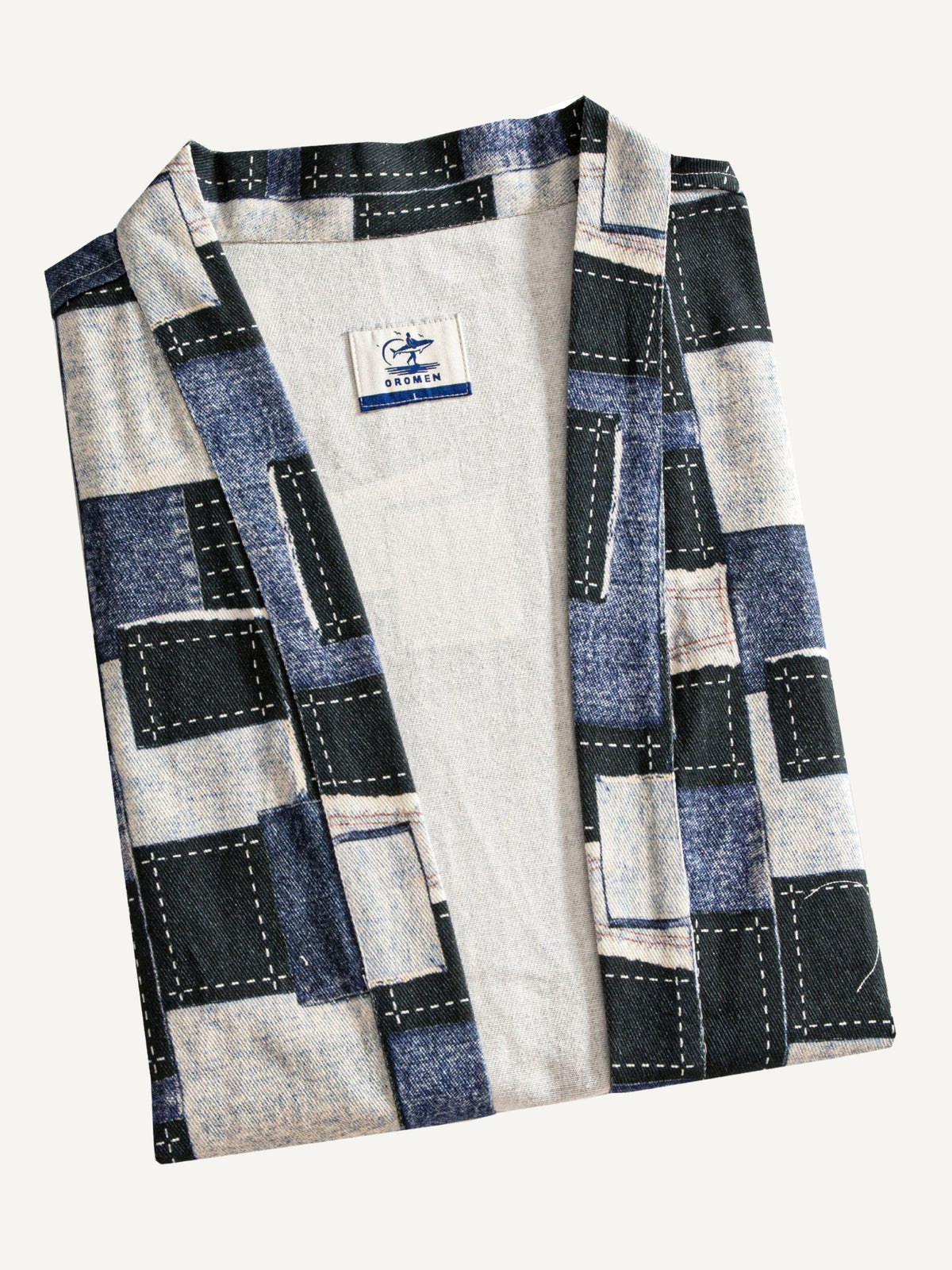 OROMEN patchwork kimono cardigan folded, showing pattern and texture