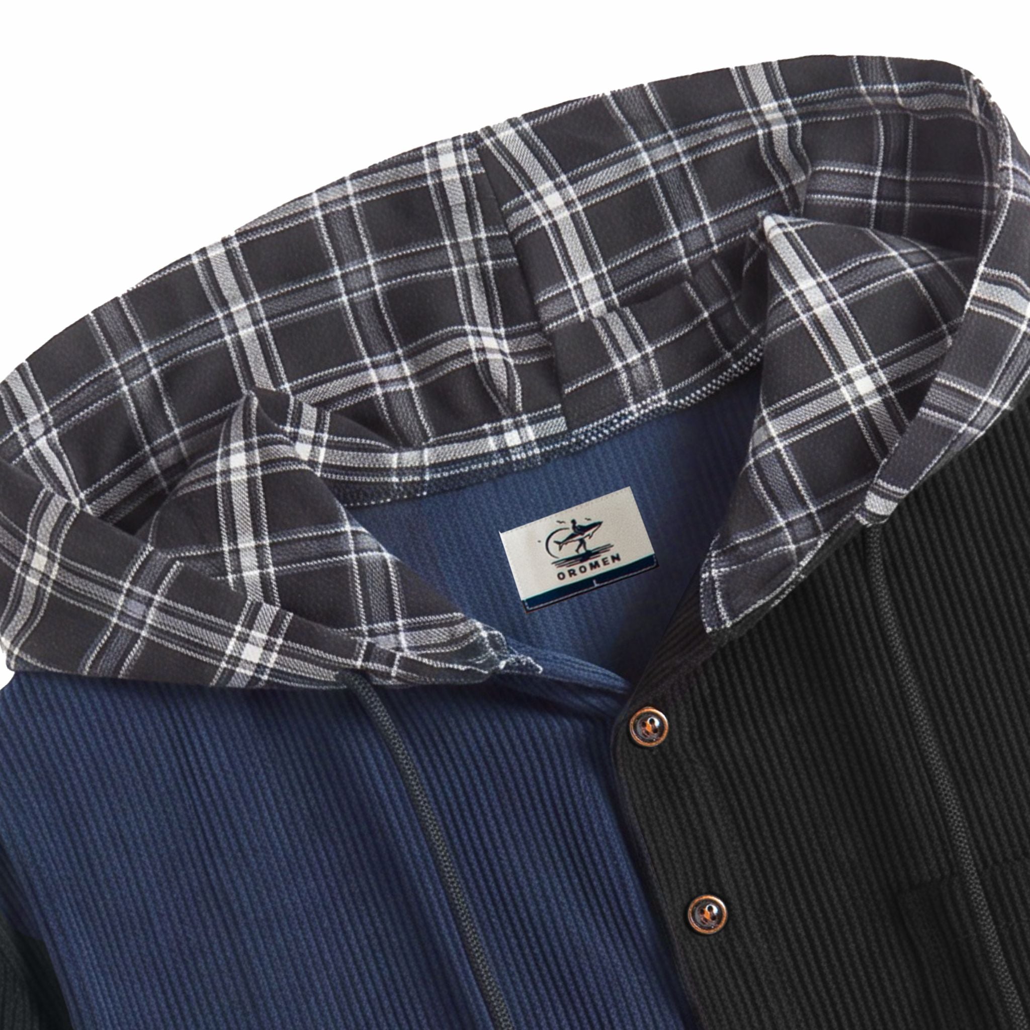 OROMEN brand label and black white plaid hood close-up on navy and black corduroy colorblock shirt