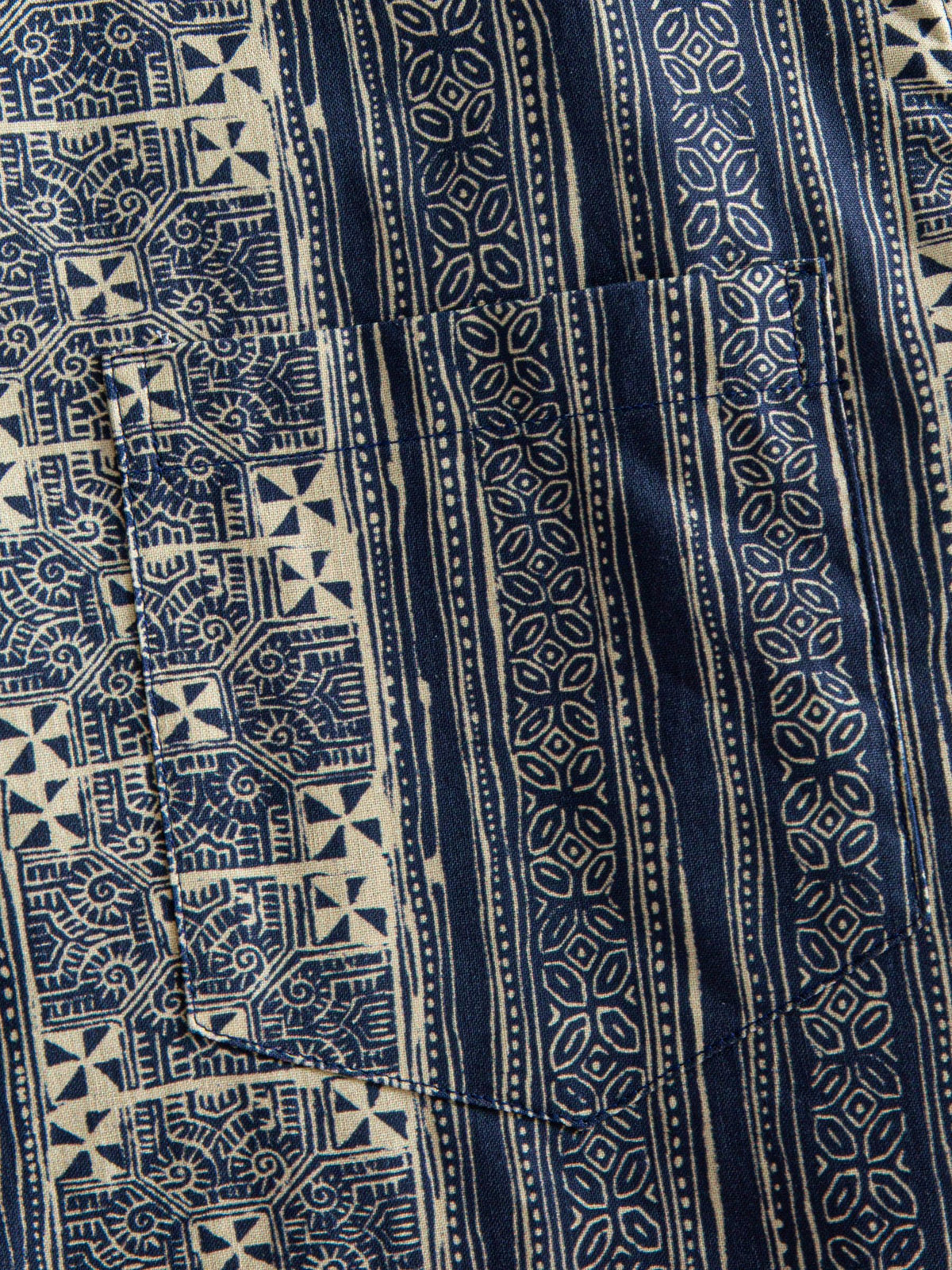 Pattern-matched chest pocket detail of OROMEN Indigo Batik Shirt