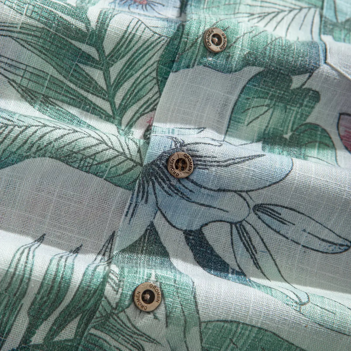 Premium linen fabric texture with botanical floral print close-up