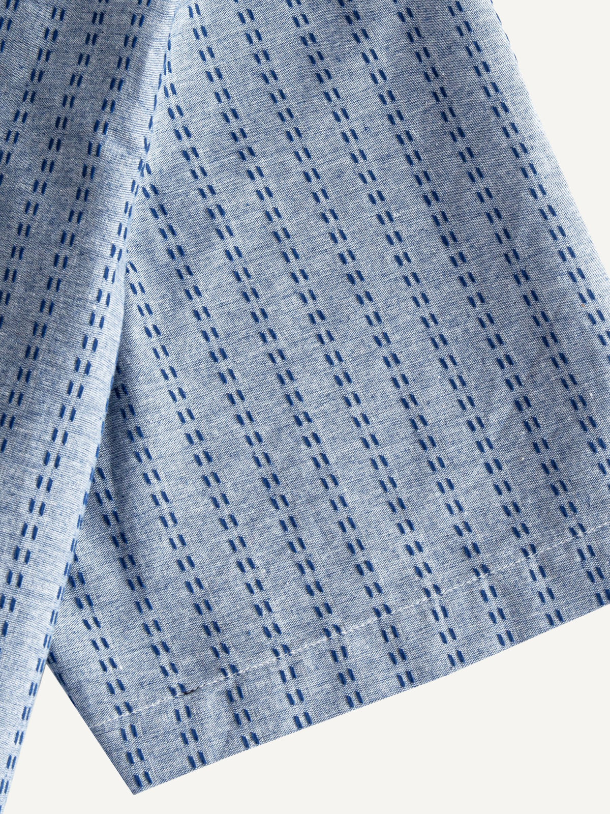 Short sleeve cuff and double-needle stitching detail of OROMEN Sashiko Chambray Cotton Shirt
