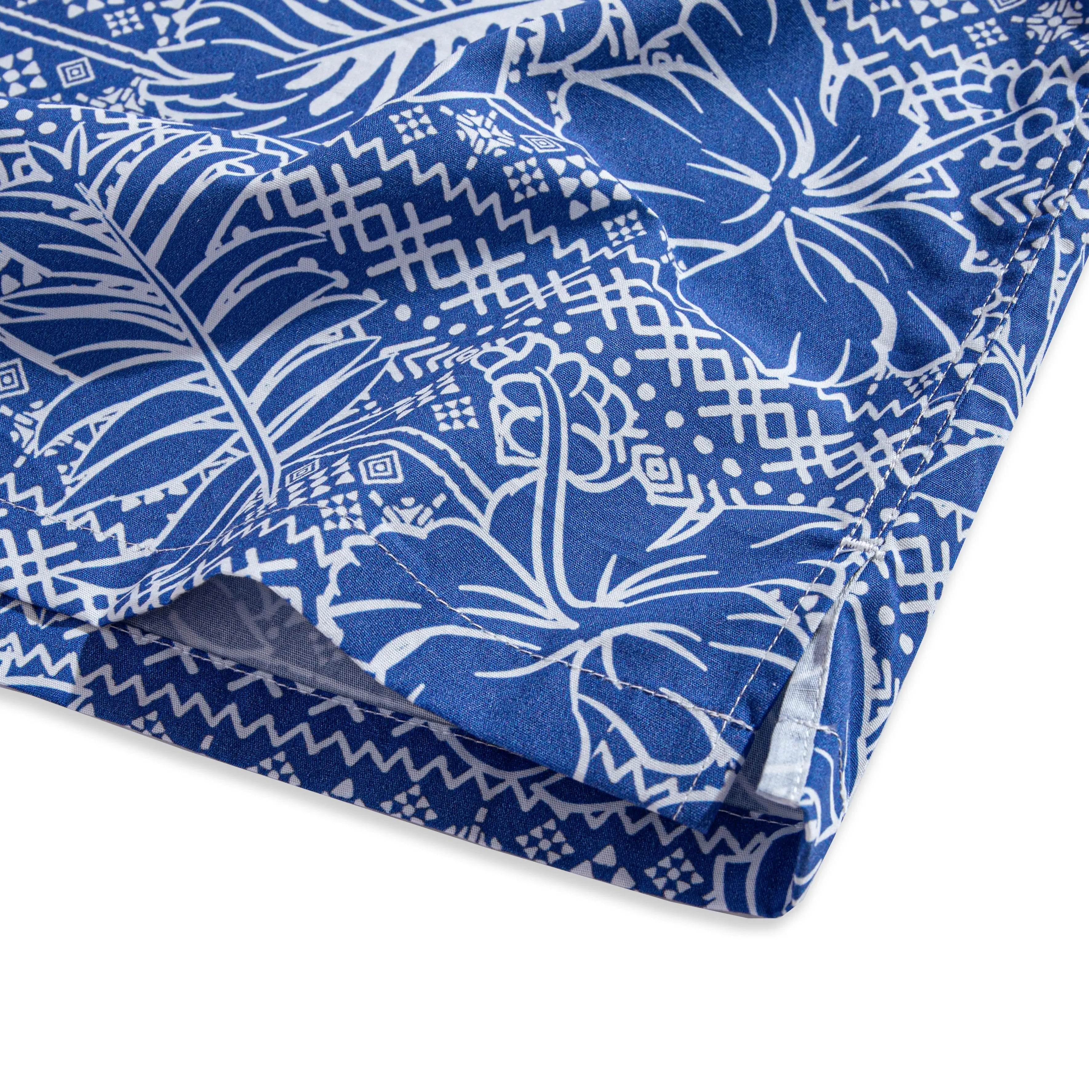Side vent detail of OROMEN Plant Totem Hawaiian shirt – relaxed fit hem with retro totem print