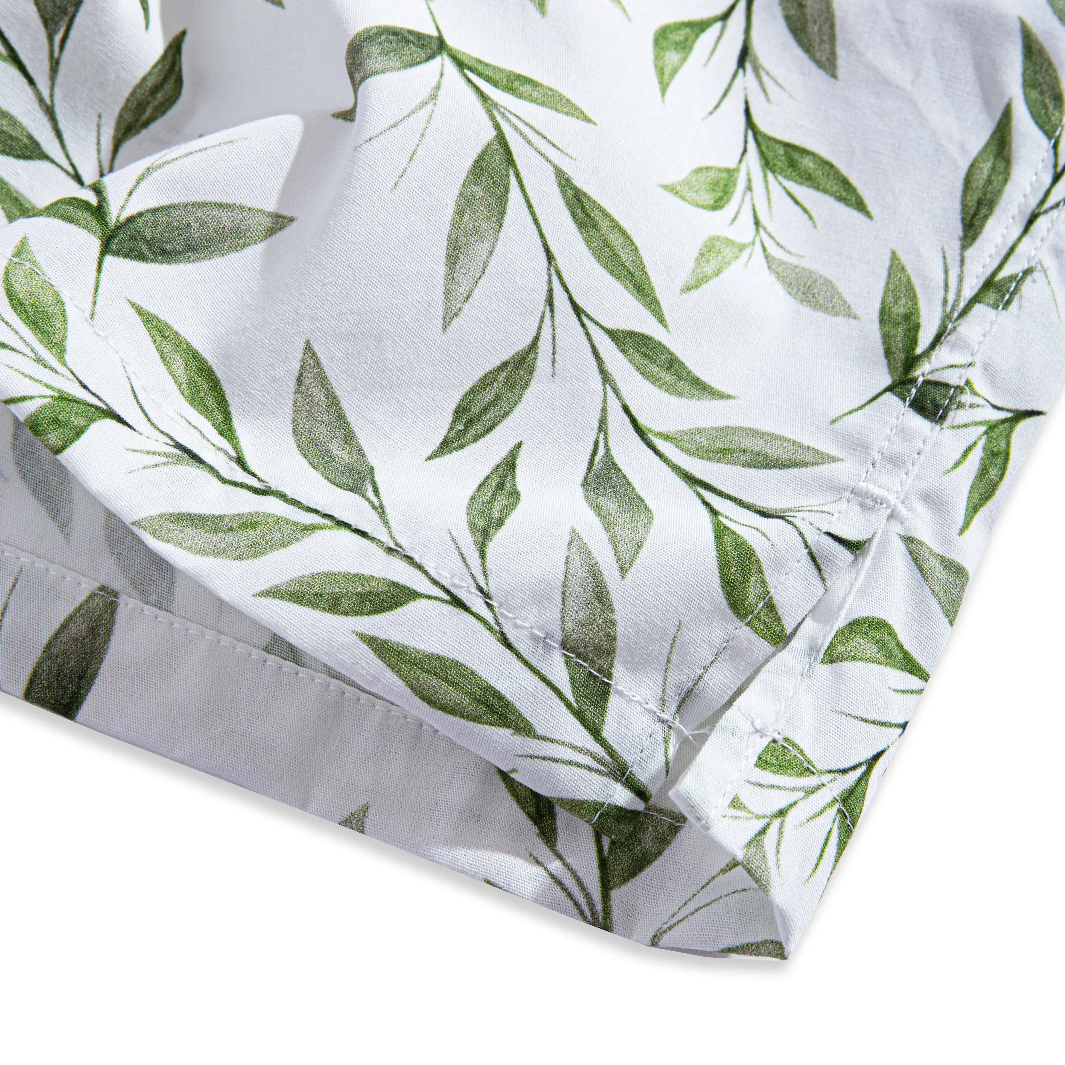 Side vent detail of OROMEN Willow Bough Hawaiian shirt – relaxed fit hem with green willow branch print