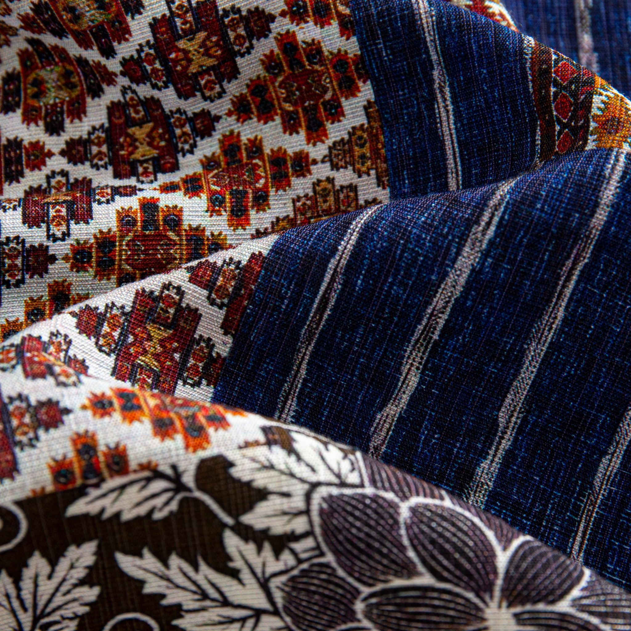 Silk Road Patchwork shirt fabric drape showing three patchwork panels layered - Persian carpet print, indigo ikat stripe and dark brown large floral