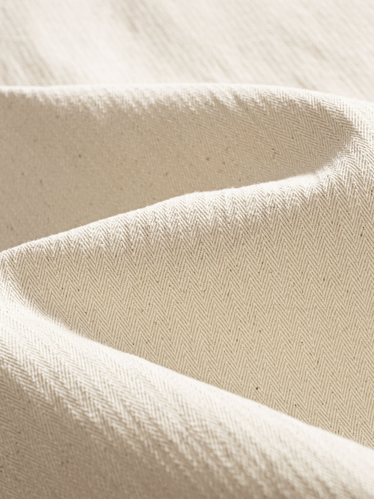 Texture detail of 100% pure cotton breathable slub weave fabric in beige