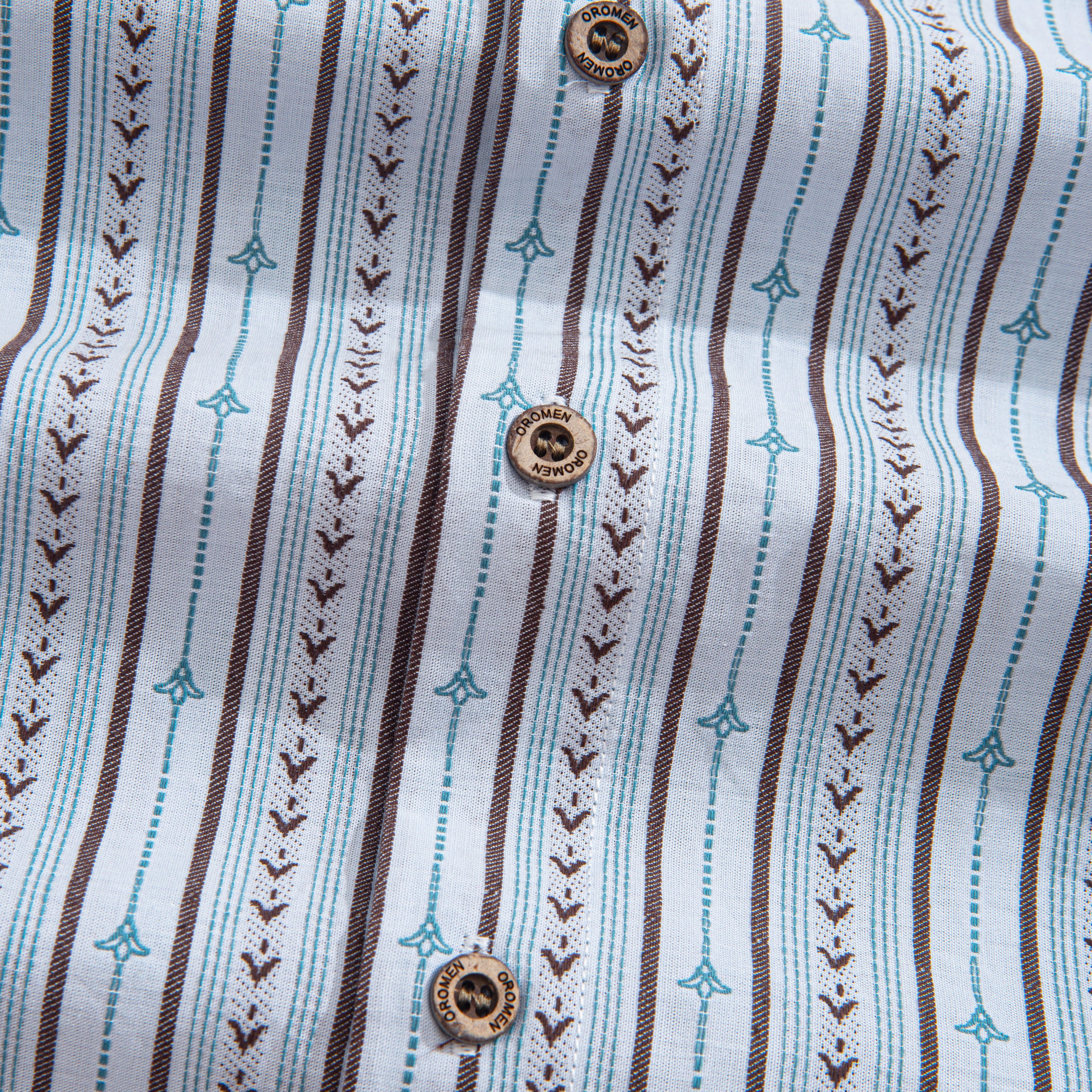 Textured ribbon stripes and embroidery detail on retro cotton aloha shirt